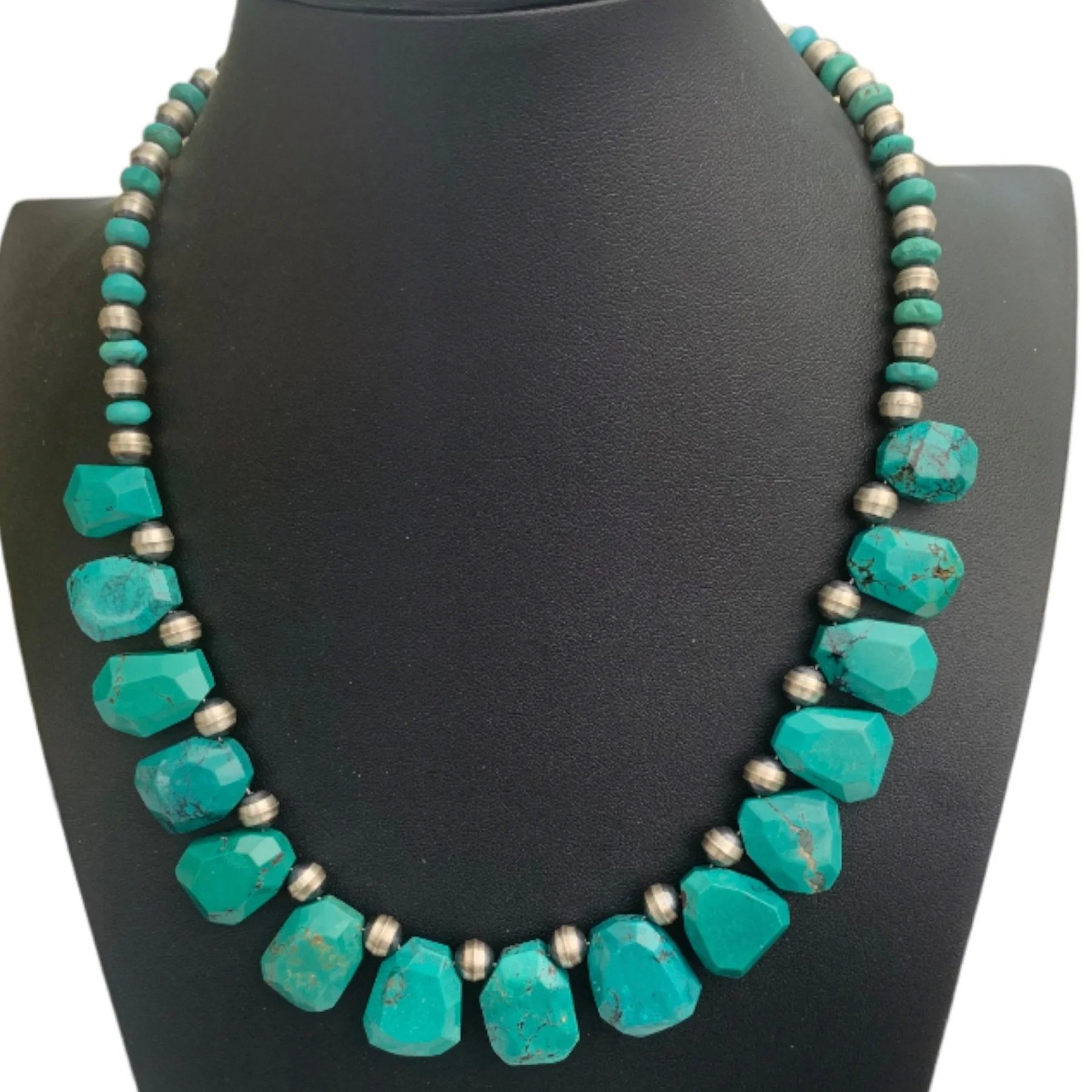 Turquoise and silver beaded necklace on a black display bust with the text 'Victoria's Southwest Designs' at the bottom.