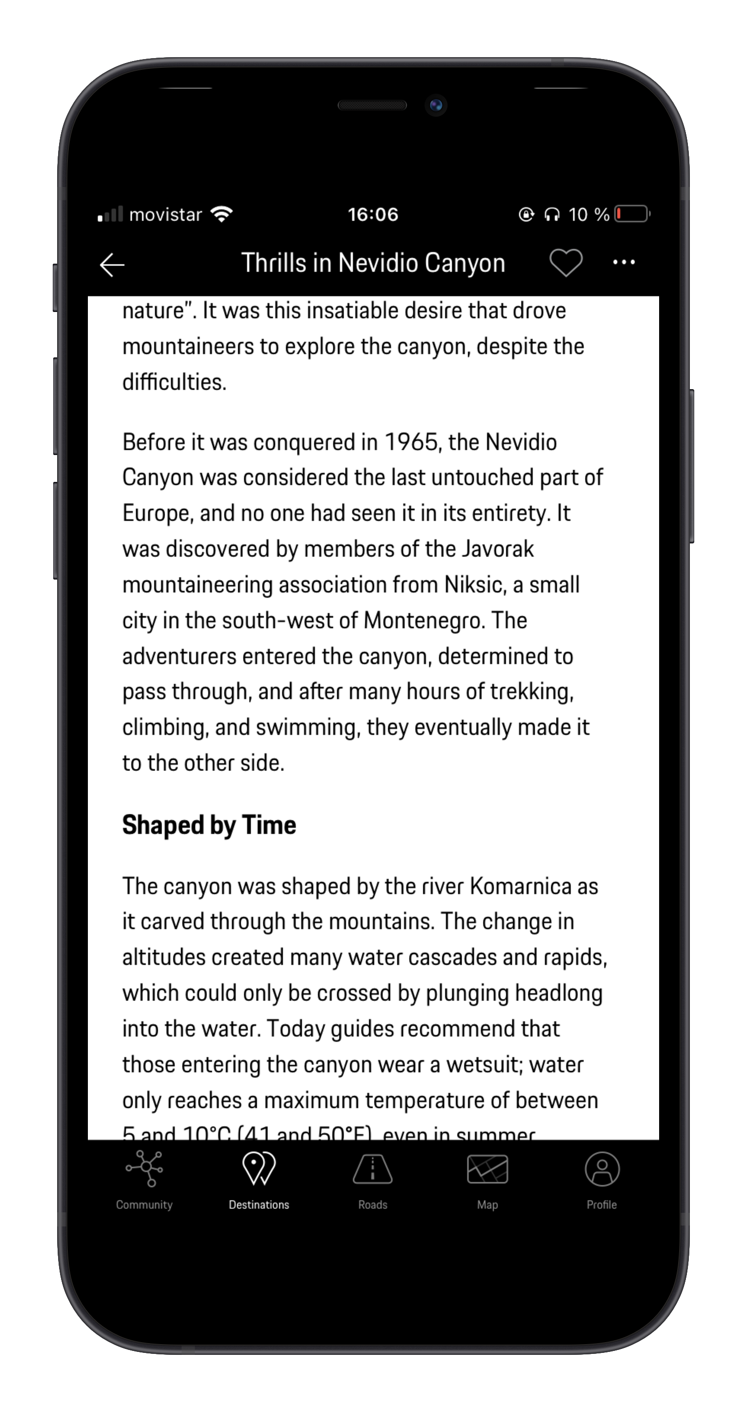 Mobile phone screen displaying an article titled 'Thrills in Nevidio Canyon' with text about the canyon's history and features, with navigation icons at the bottom for community, destinations, roads, map, and profile.