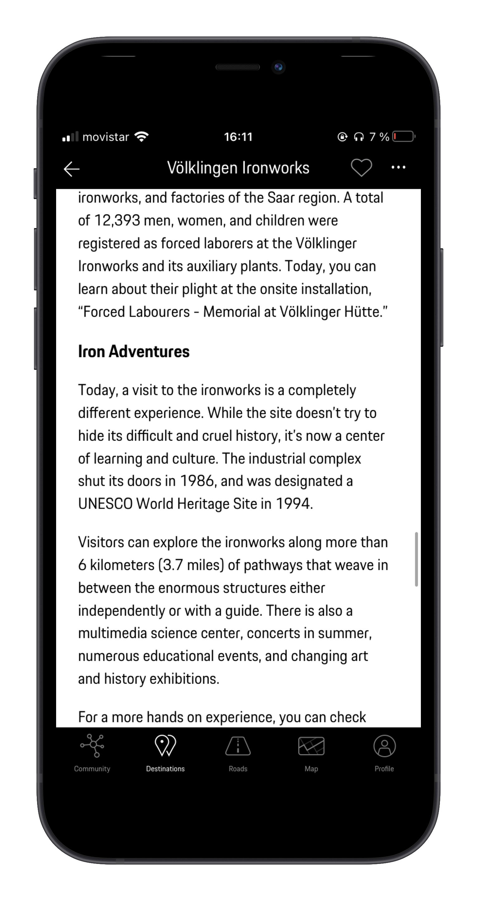 Mobile phone screen displaying a webpage about Völklingen Ironworks, a UNESCO World Heritage Site in Germany, including historical information, visitor experience details, and navigation icons at the bottom.