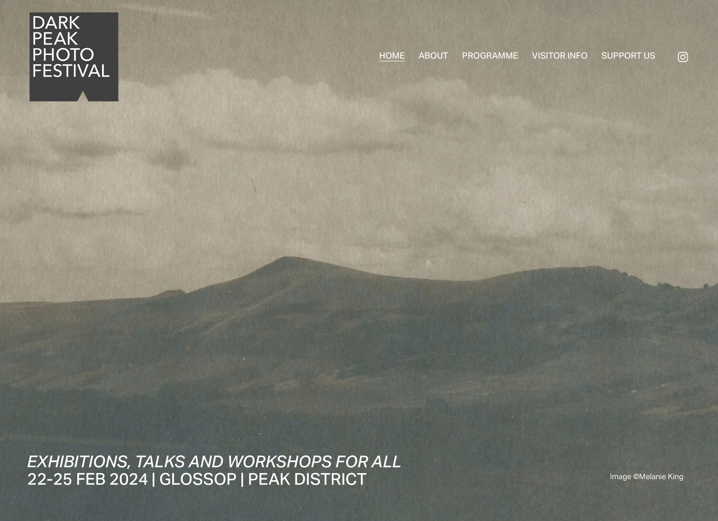 A promotional webpage for the Dark Peak Photo Festival featuring a sepia-toned landscape of rolling hills and clouds, with event details including date and location.