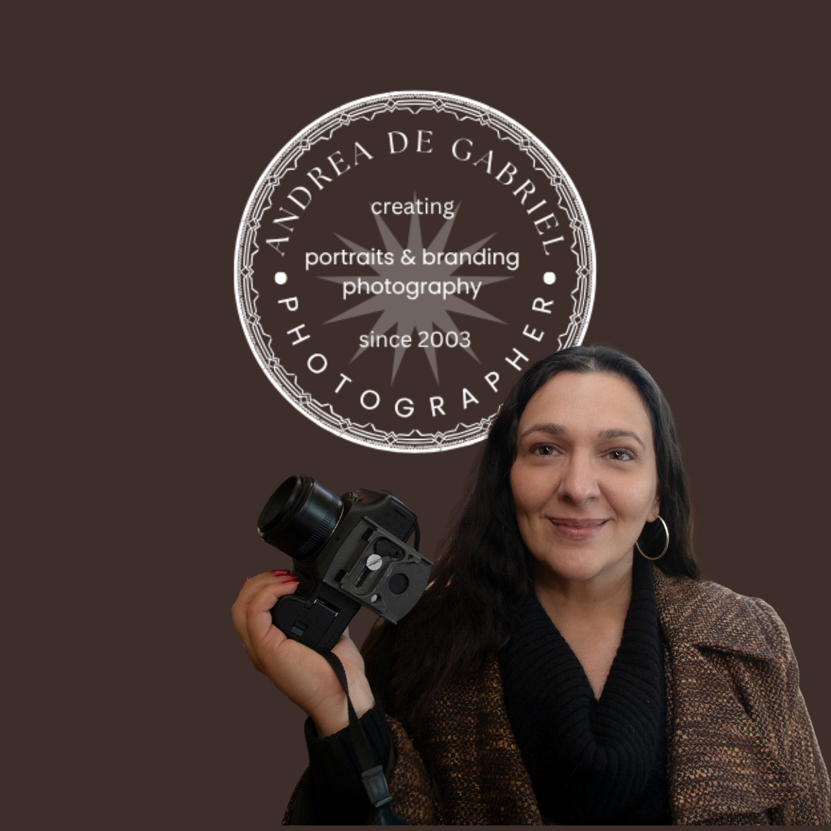 Photo of a woman holding a camera, with a logo in the background that reads 'Andrea de Gabrielle Photography, creating portraits & branding photography since 2003'.
