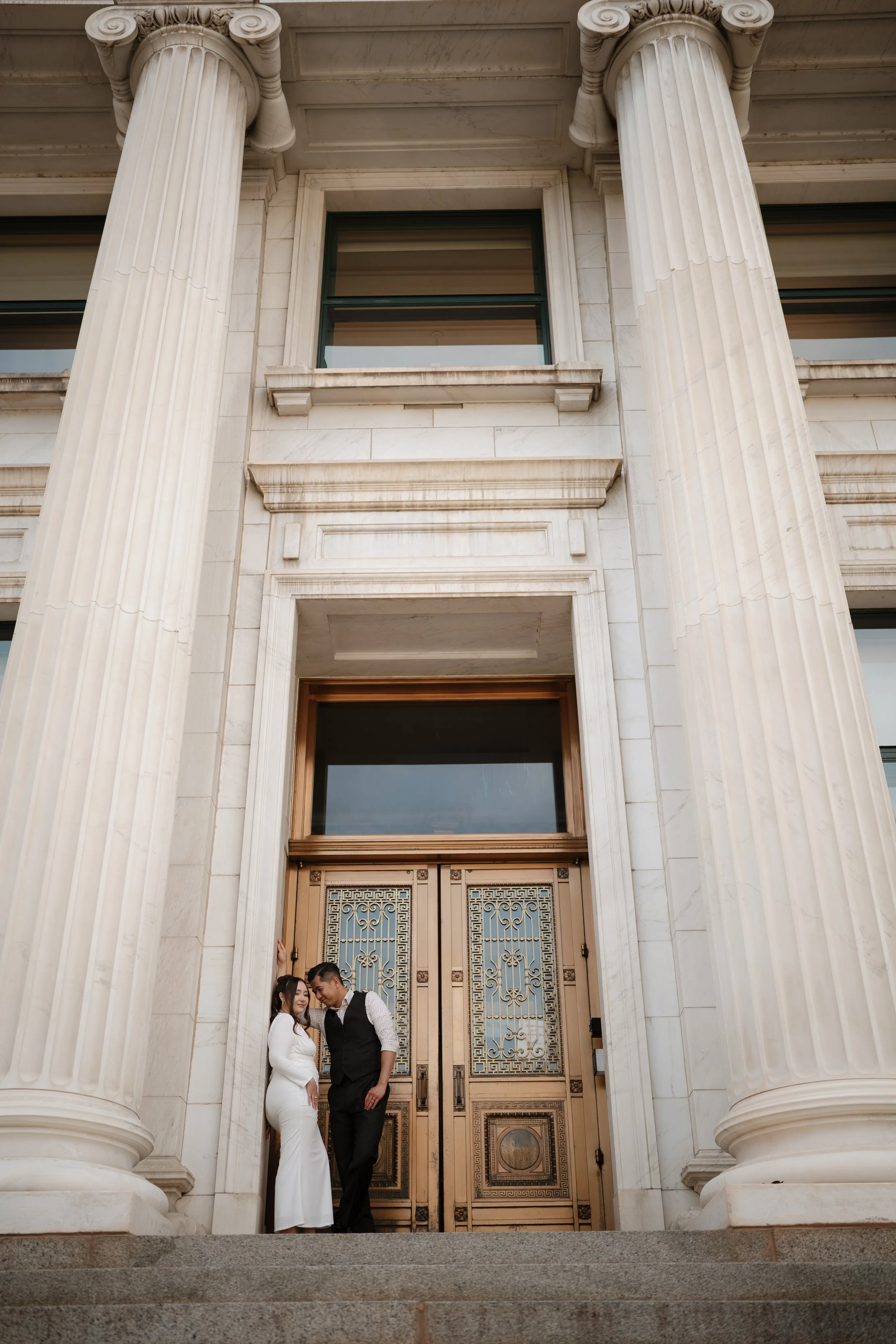 Adventure-inspired engagement session in Colorado featuring a couple surrounded by breathtaking mountain landscapes, golden light, and natural scenery. Authentic and emotional engagement photography with a cinematic outdoor aesthetic.