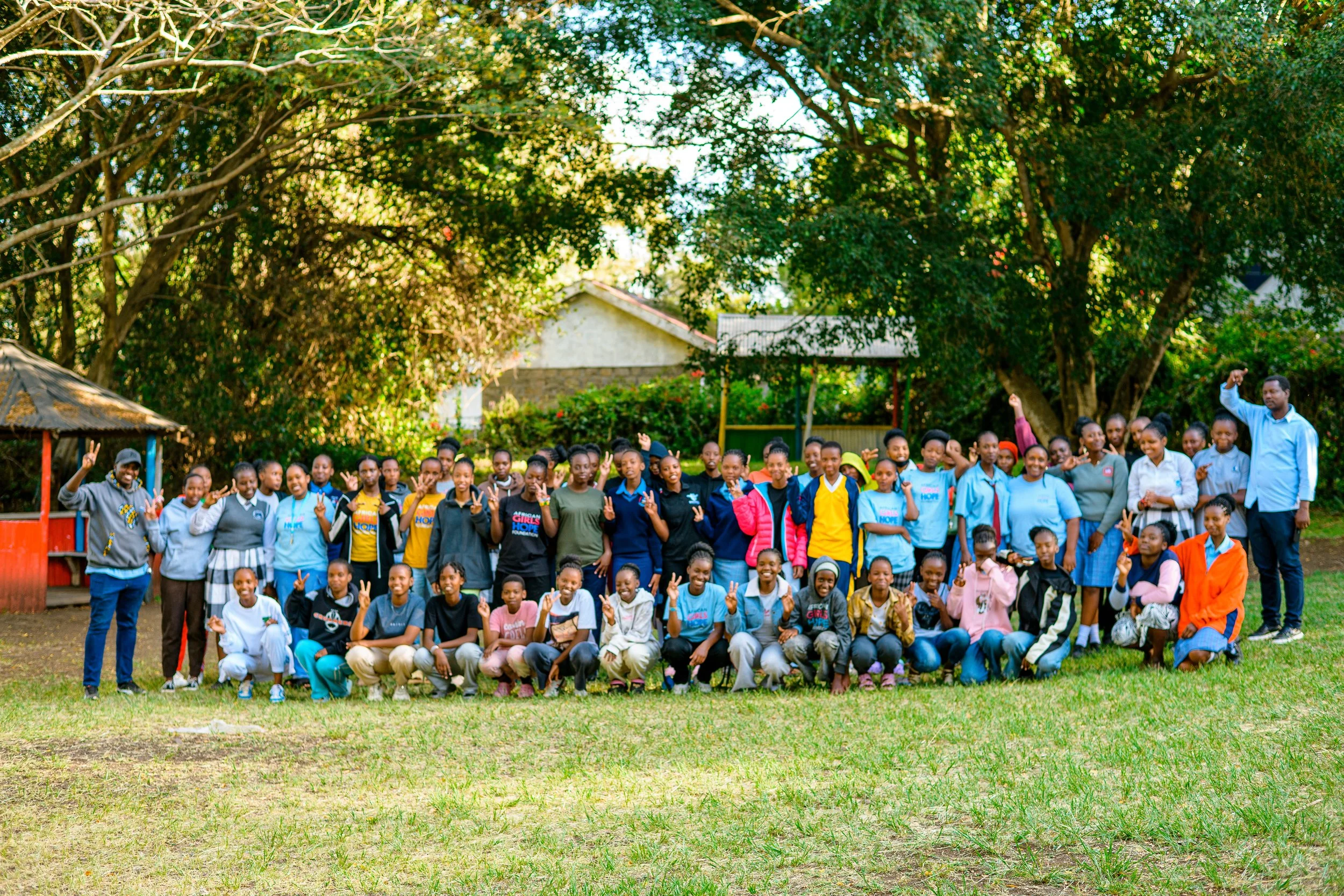 African Girls gathered before getting on the bus to go go school.