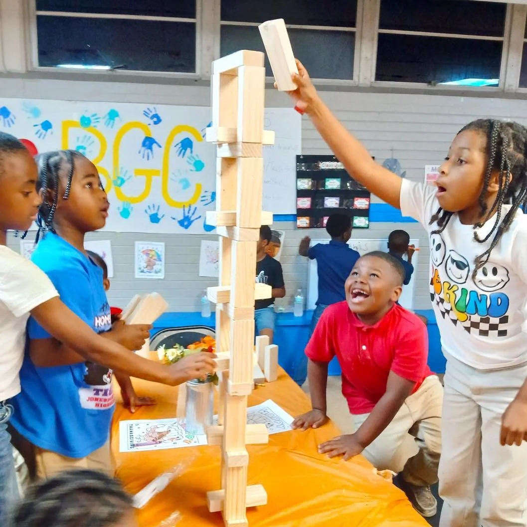 Stacking blocks, building confidence! A friendly game of Jenga brings teamwork, laughter, and a whole lot of suspense to the Club.