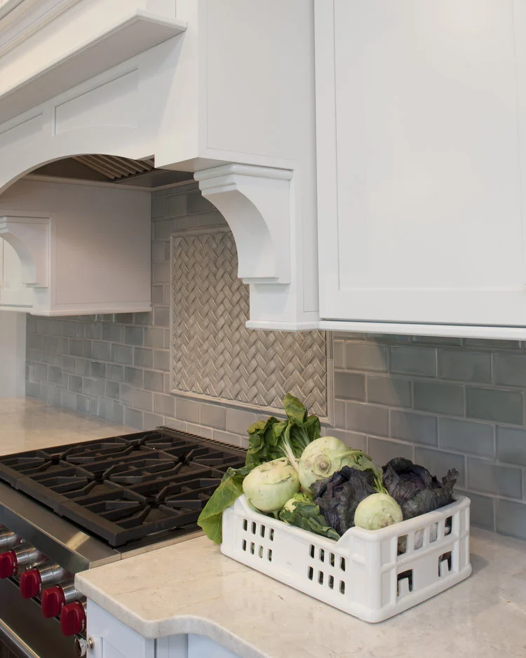 kitchen with quartz counter tops, ceramic vegetable tray, fresh veggies, wolf range, hood, custom millwork, grey tile, Sonoma tile, basketweave, backsplash, Interior design, interior designer, home design, home decor, interiors, designer, Main Line, 