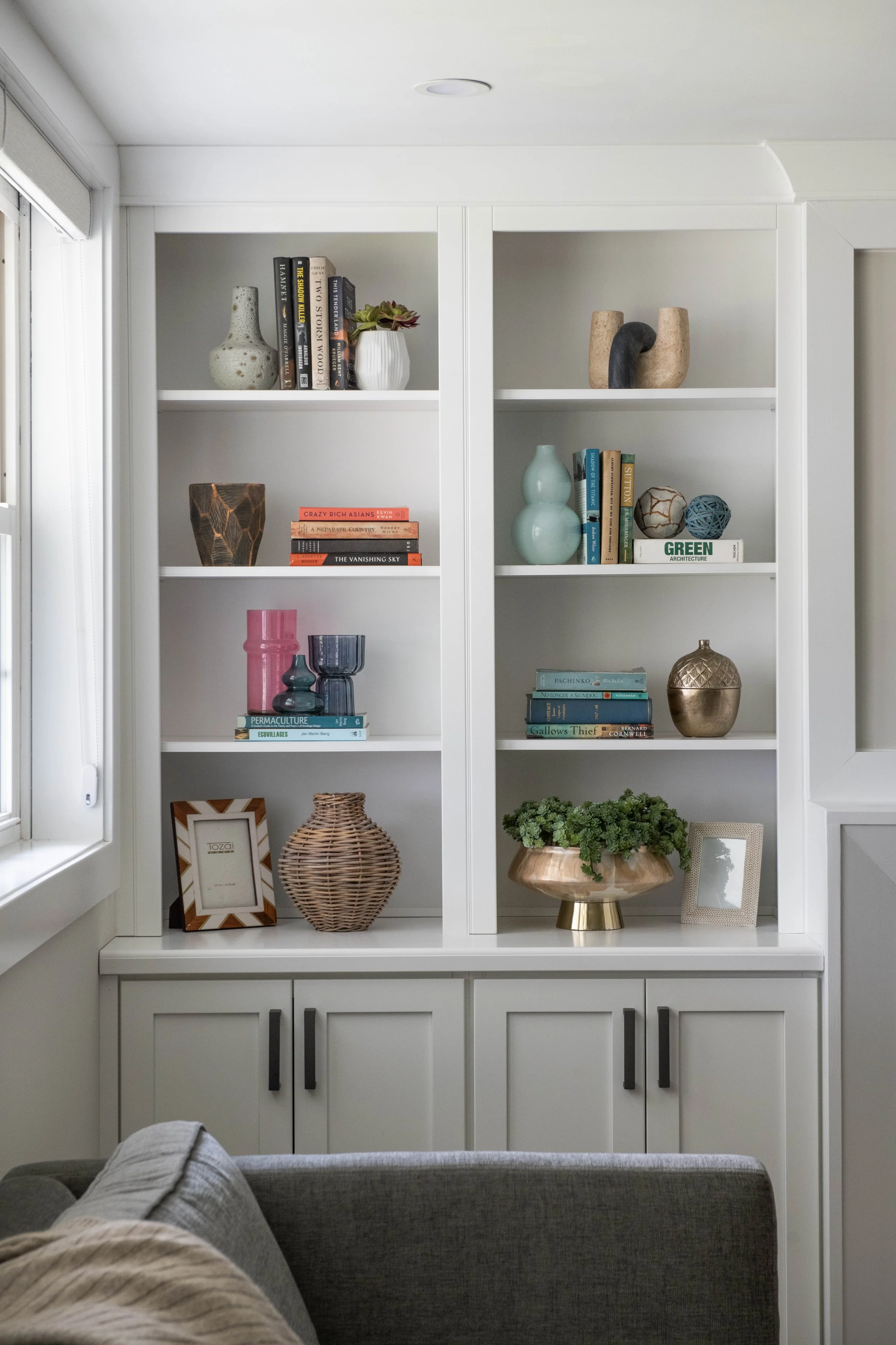 Family room, basement, built-ins, fireplace, accessories, sectional, sofa, ottoman, console, natural light, soft neutrals, bright and airy, white walls, villanova, pa, main line, philadelphia, chester county, interior design, renovation, interior des