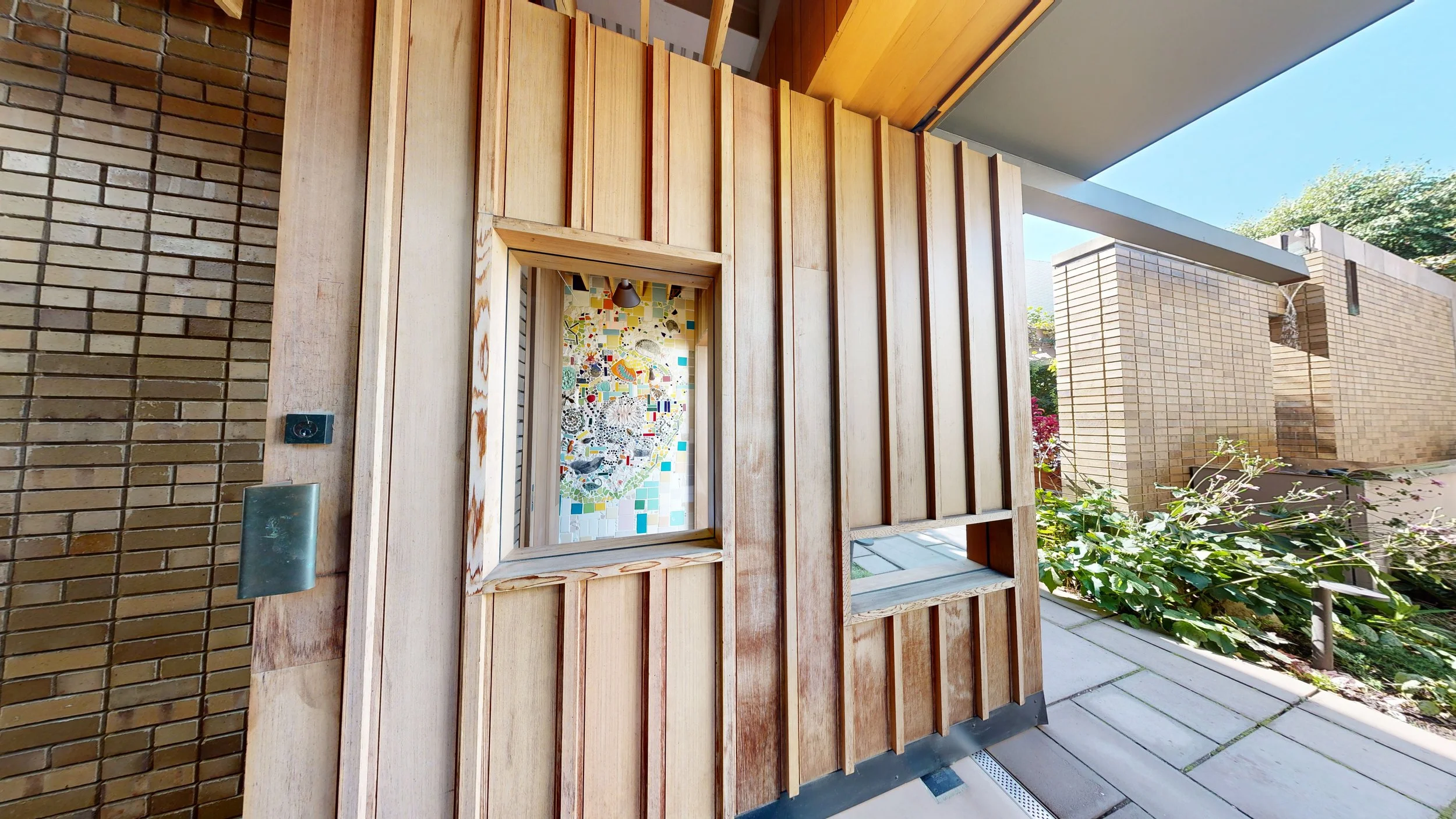 The Carroll Hall pivot door seamlessly connects our outdoor garden to our indoor hall at this Brooklyn event space.