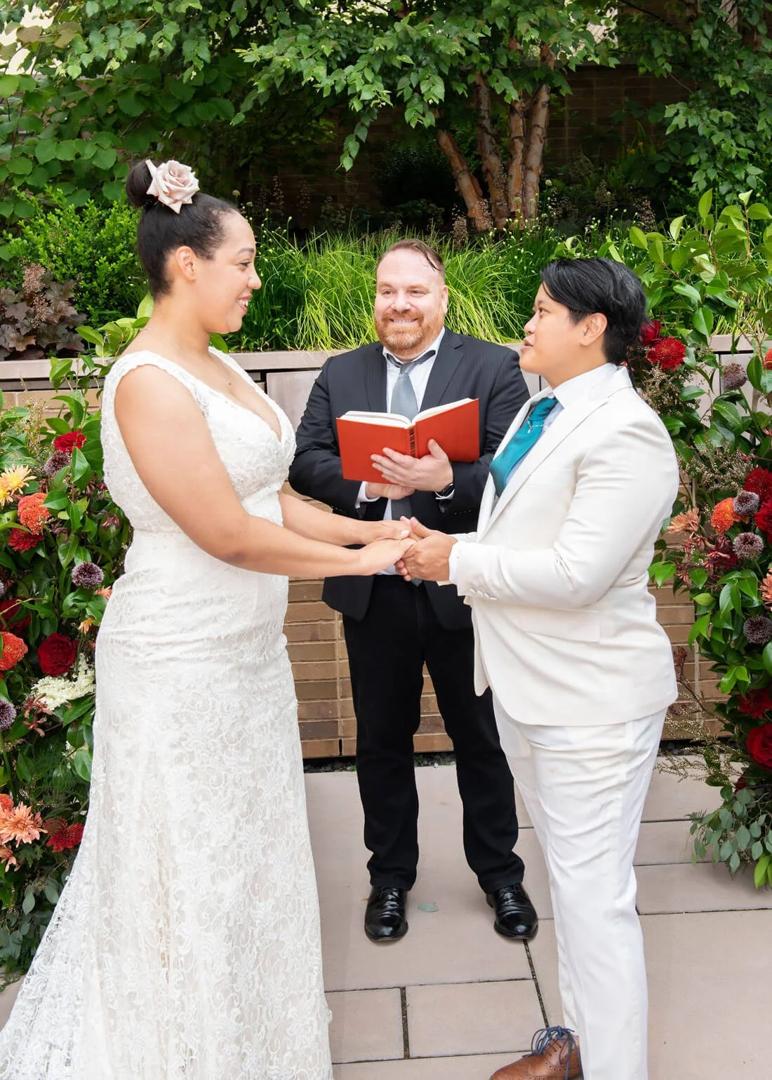 A couple having a vow renewal in the Carroll Hall Garden