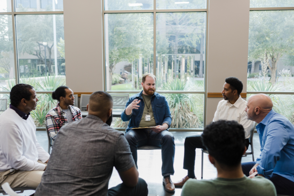 Group of men learning about healthy masculinity. Practicing learning inner world, emotional depth, and interpersonal skills.