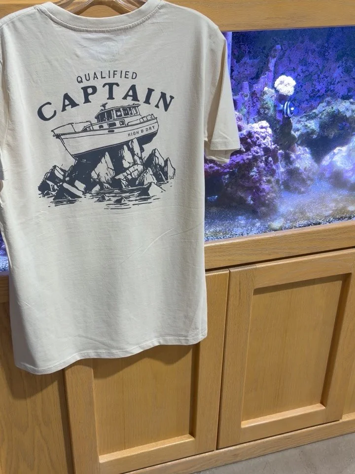We are stocked up on The Qualified Captain for the summer season!!! Boating apparel built for long days on the water and even better stories after. Laid back, comfortable, and ready for whatever the lake throws your way!