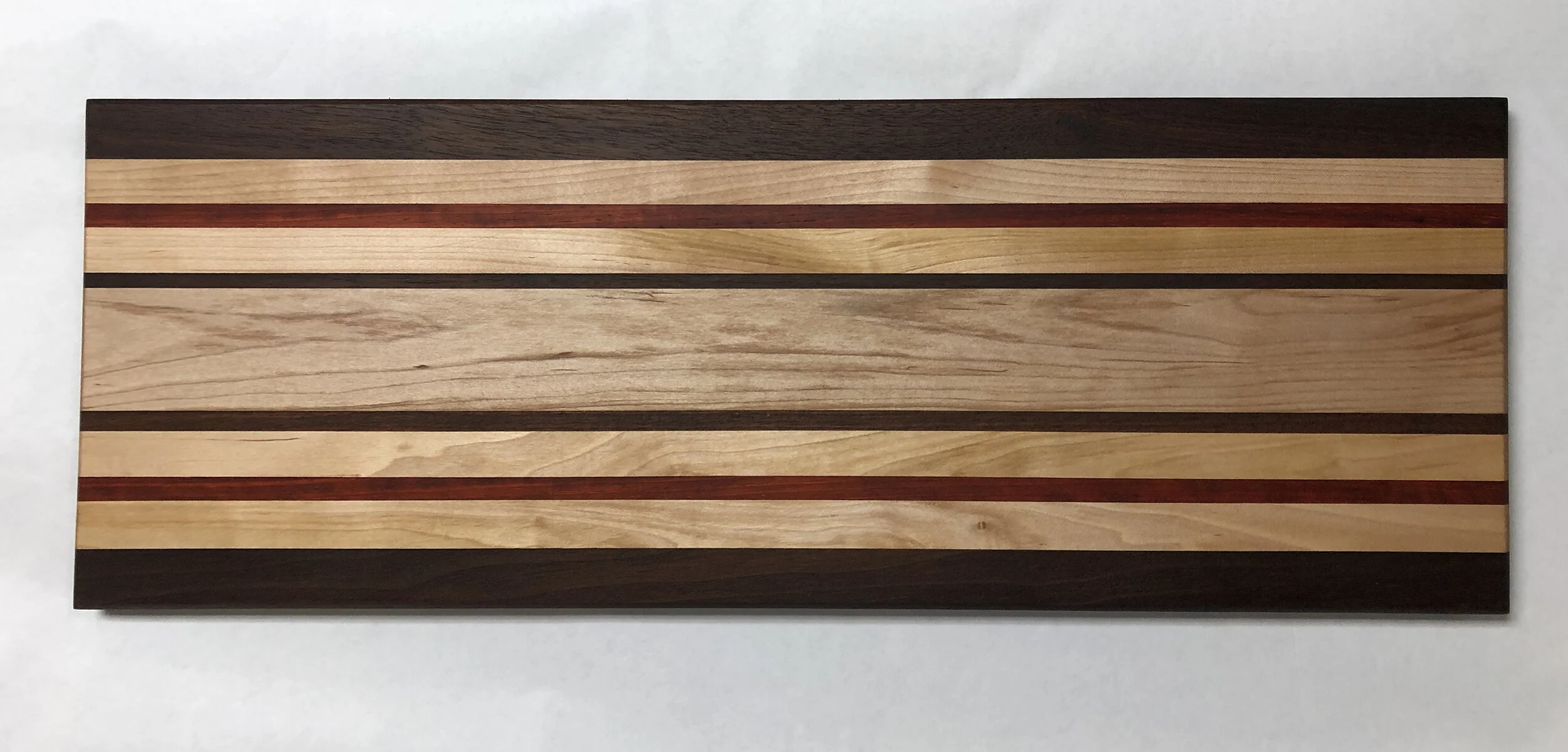 Sold ~ Charcuterie, black walnut, maple, padauk