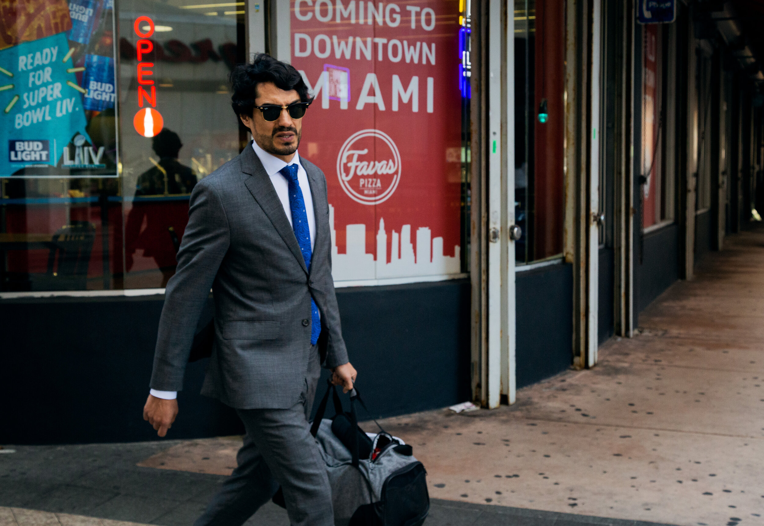 Man with Ray Bans, gym bag-.jpg