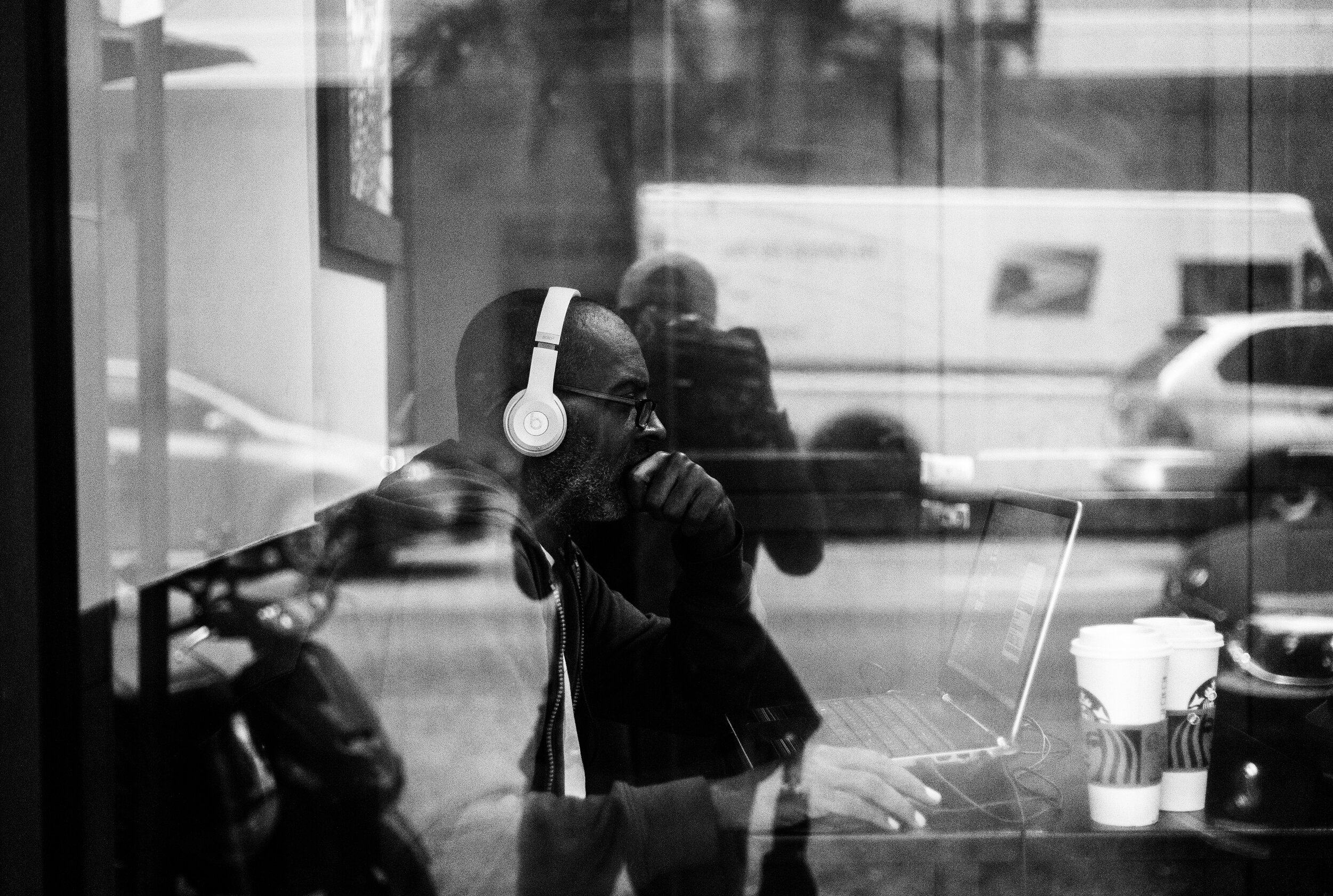 Man with Beats_Starbucks window-.jpg