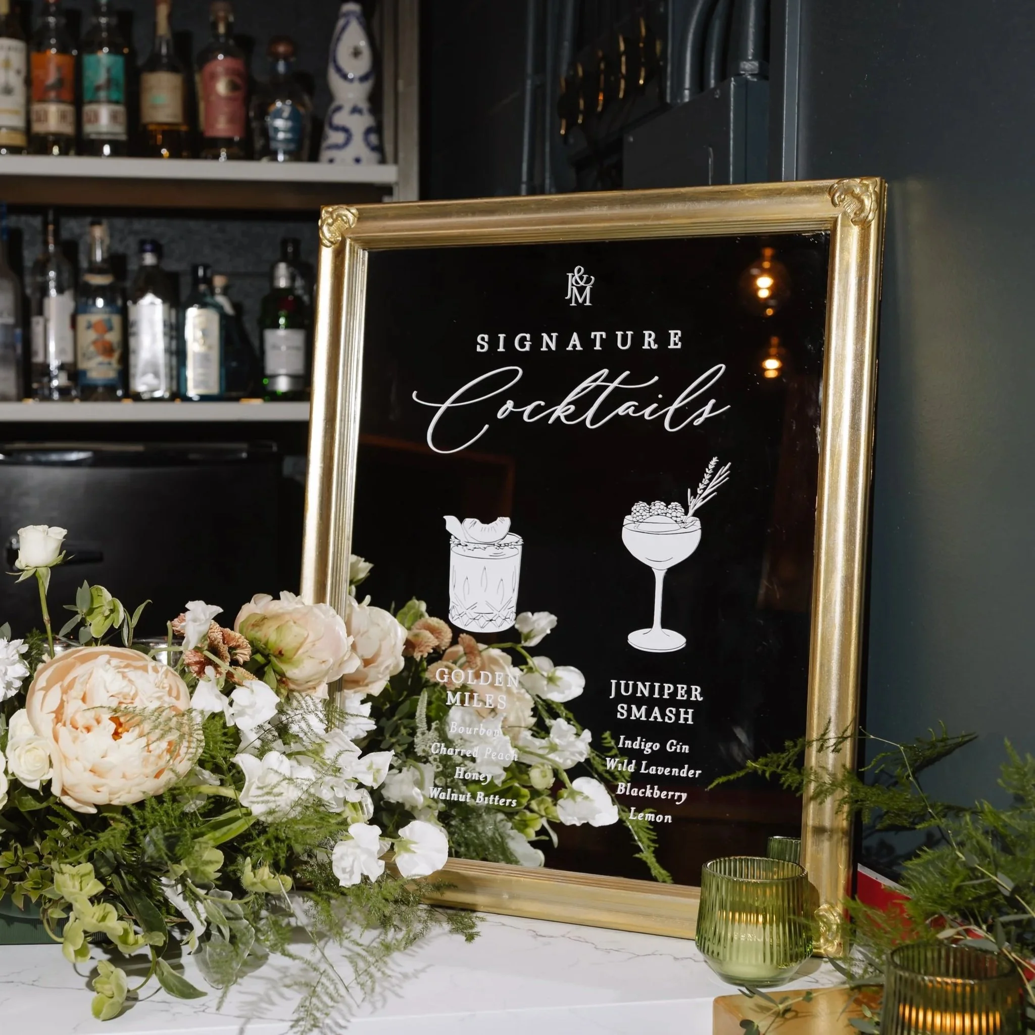 wedding signature cocktails sign on a mirror with a gold frame