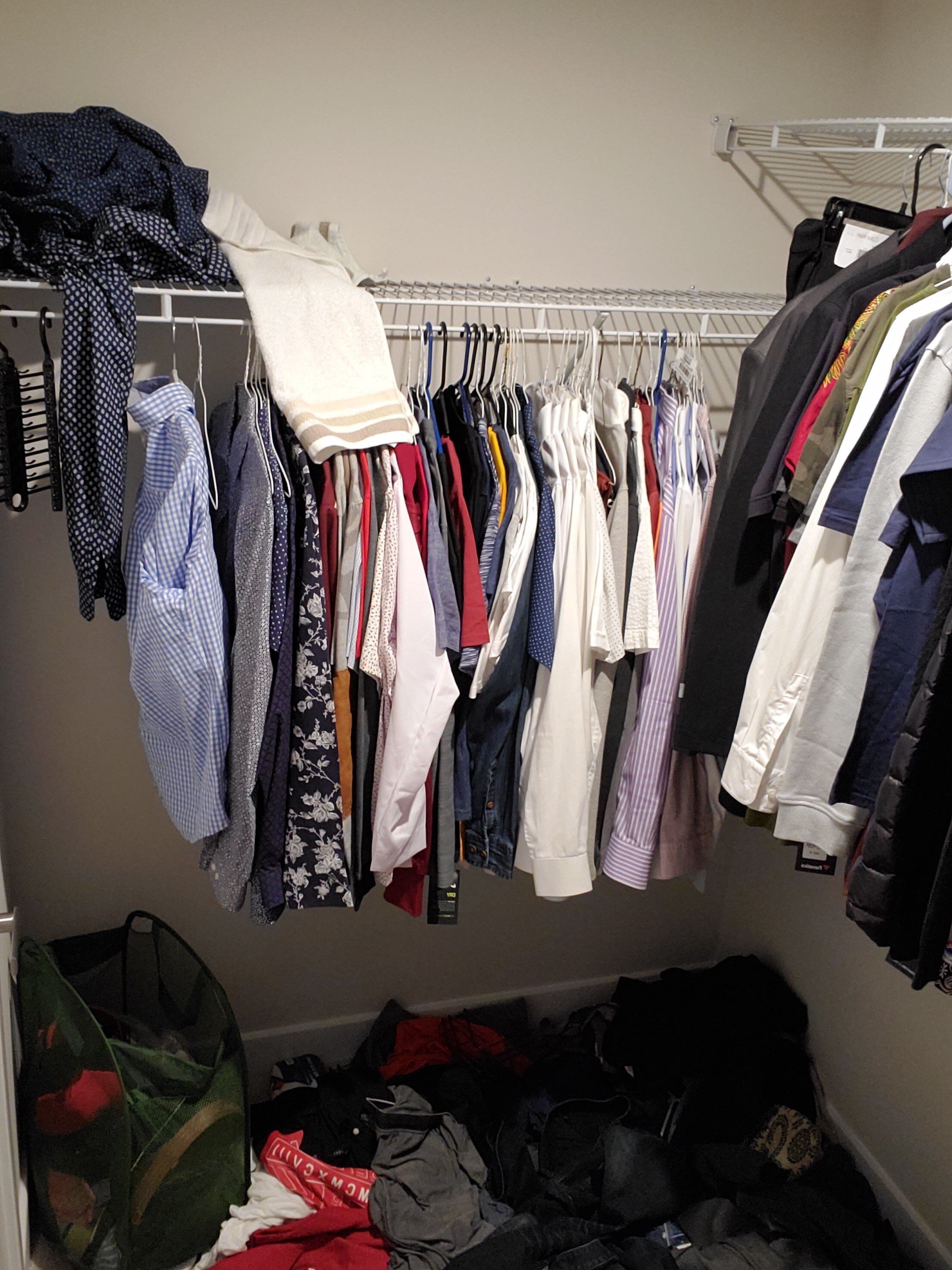 Closet - left side (before): Without sufficient hangers and proper shoe storage, the floor was becoming a holding ground for most of the client's attire.