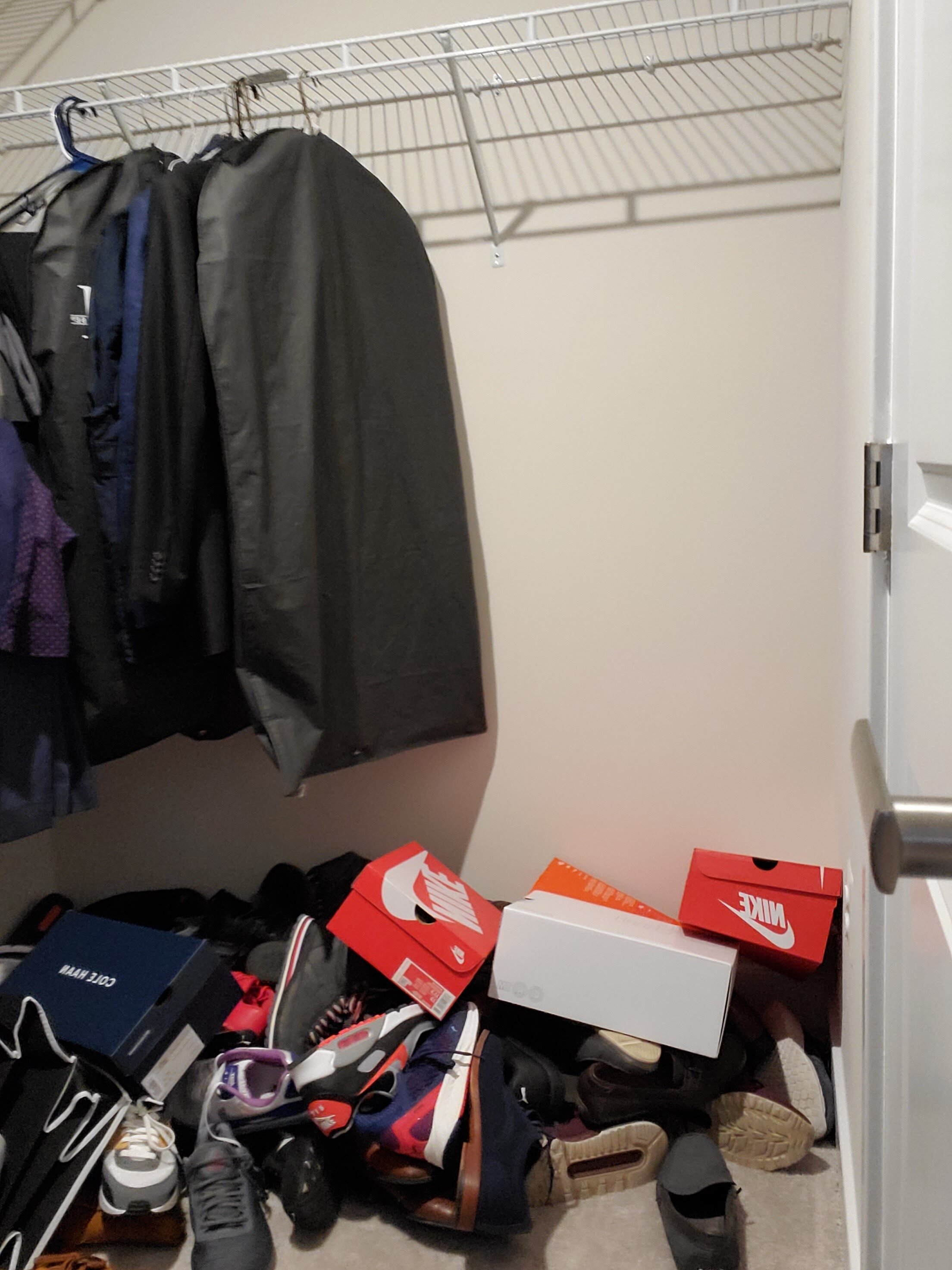 Closet - right side (before): Keeping things hidden in boxes means those articles are often forgotten.