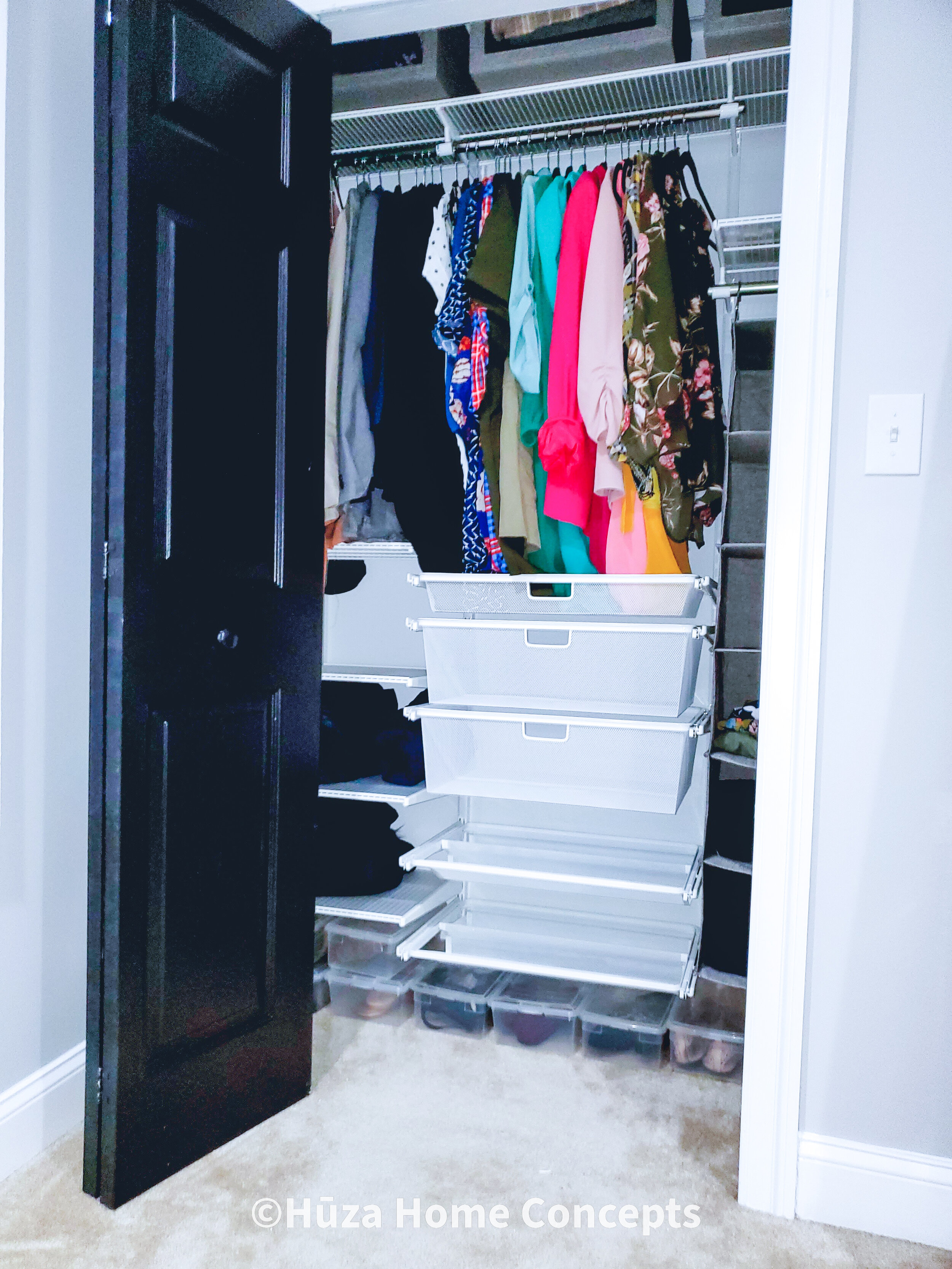 Larger Closet (after): Using containers at the top, hanging storage to the right, and shoe containers at the bottom ensured this client was able to use every square inch of closet real estate.