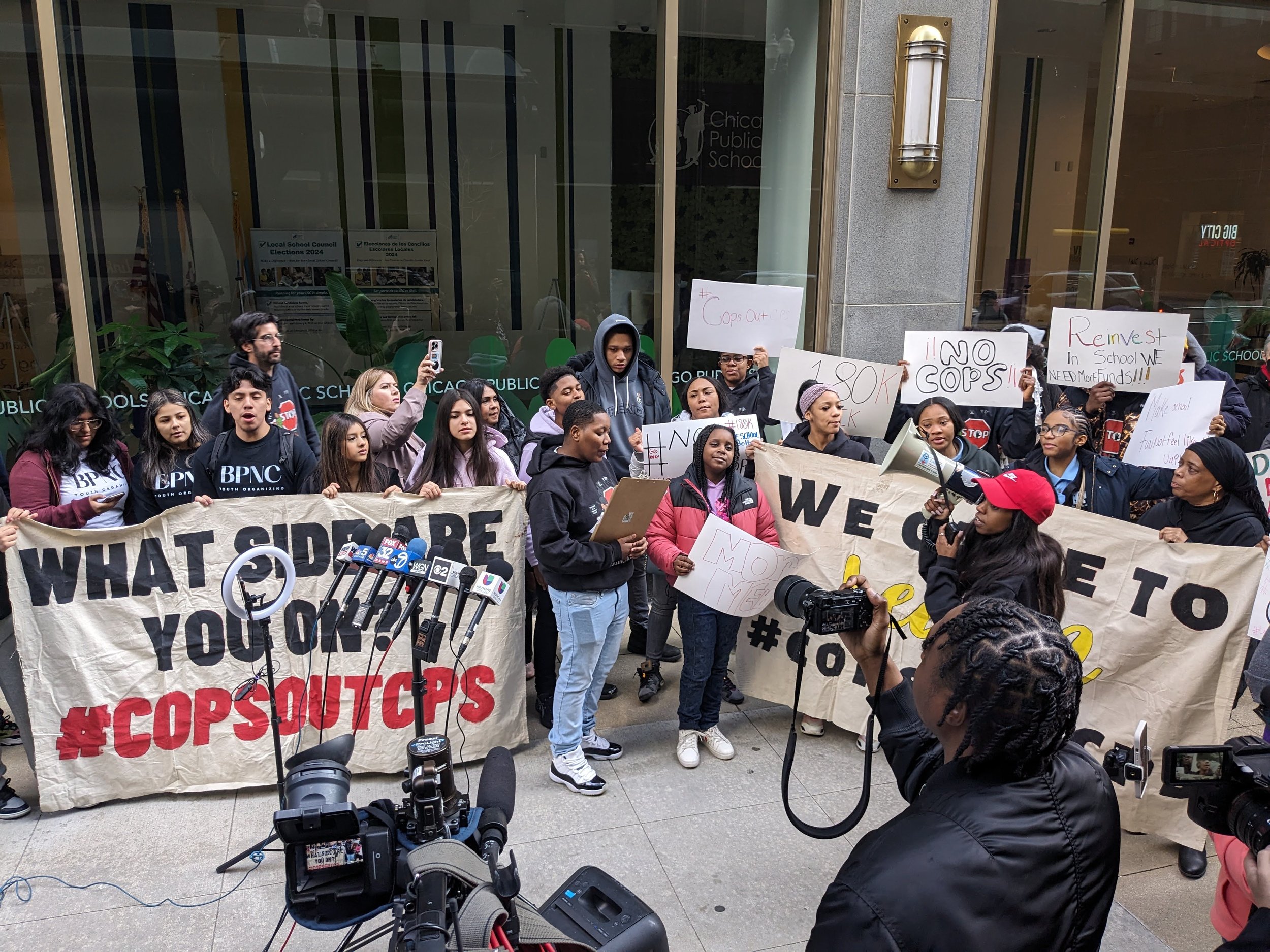   Yanni Butler, STOP’s first youth organizer on the the #CopsOutCPS campaign, leads chants  