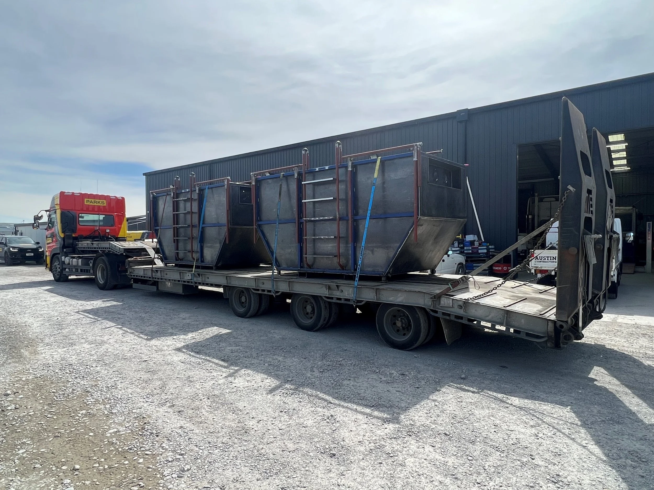 Sediment tanks being transported.jpg