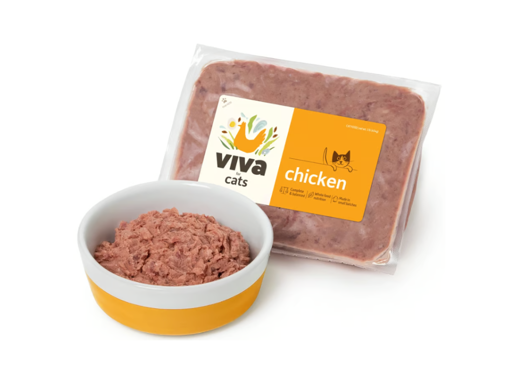 Packaged Viva Cats chicken cat food with logo, beside a yellow and white bowl filled with textured food. Clean, appealing, and nutritious.