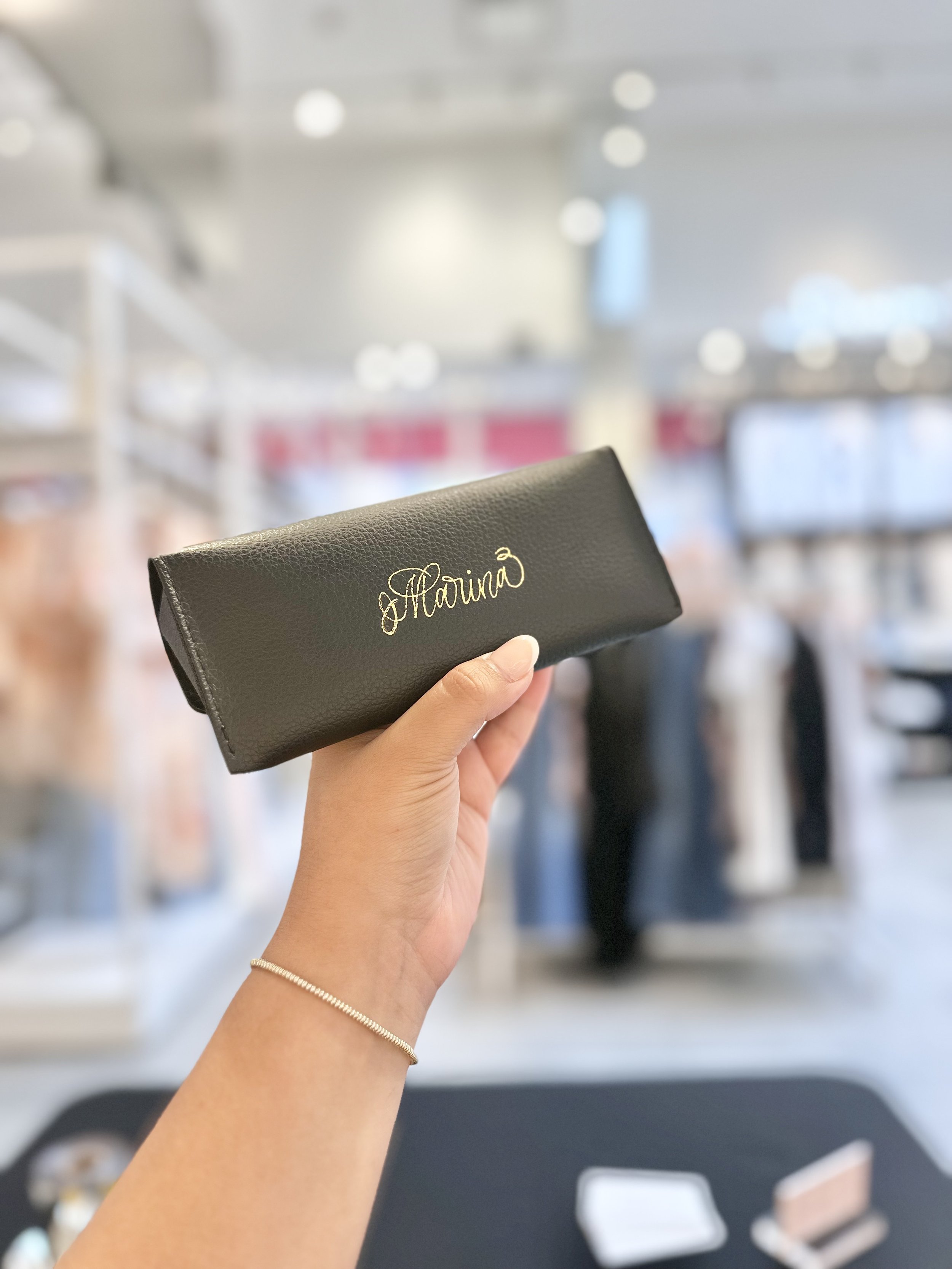 hot foiling on leather case with calligraphy by miami calligrapher a handful of letters