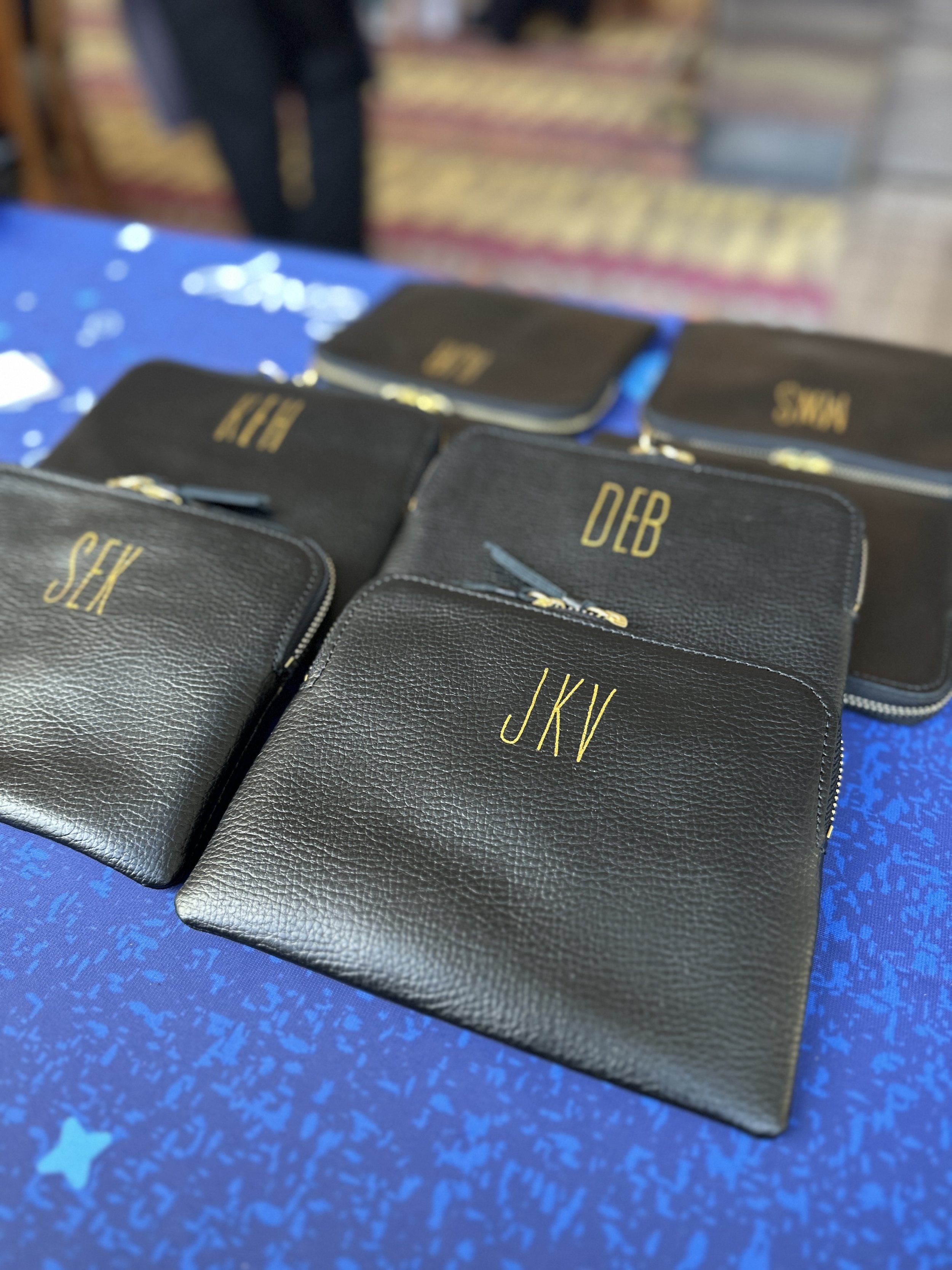 hot foiling embossing and monogramming on leather bags by Orlando calligrapher a handful of letters
