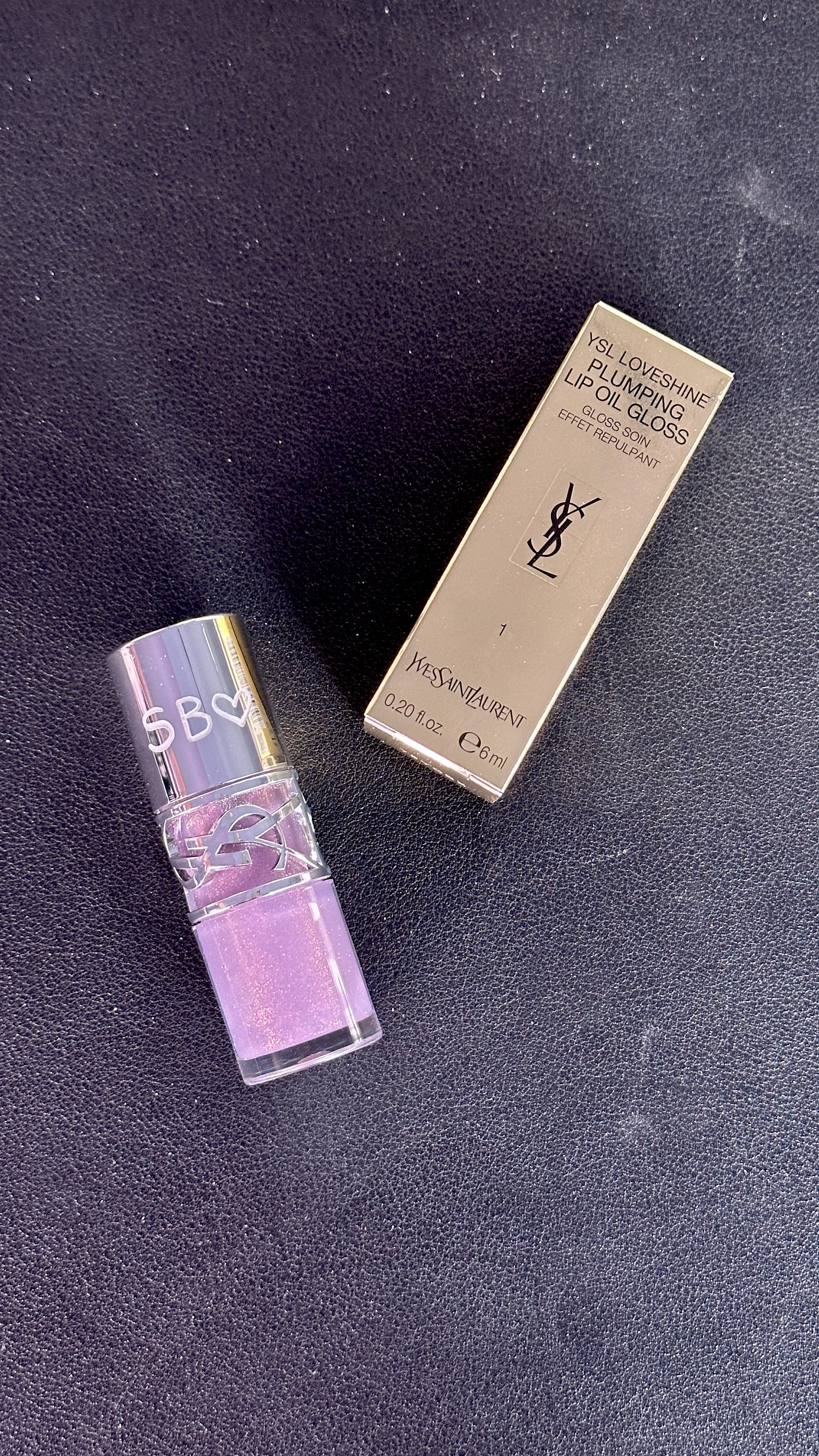 live engraving on ysl lip glosses at YSL love game pop up in Miami6287.jpeg