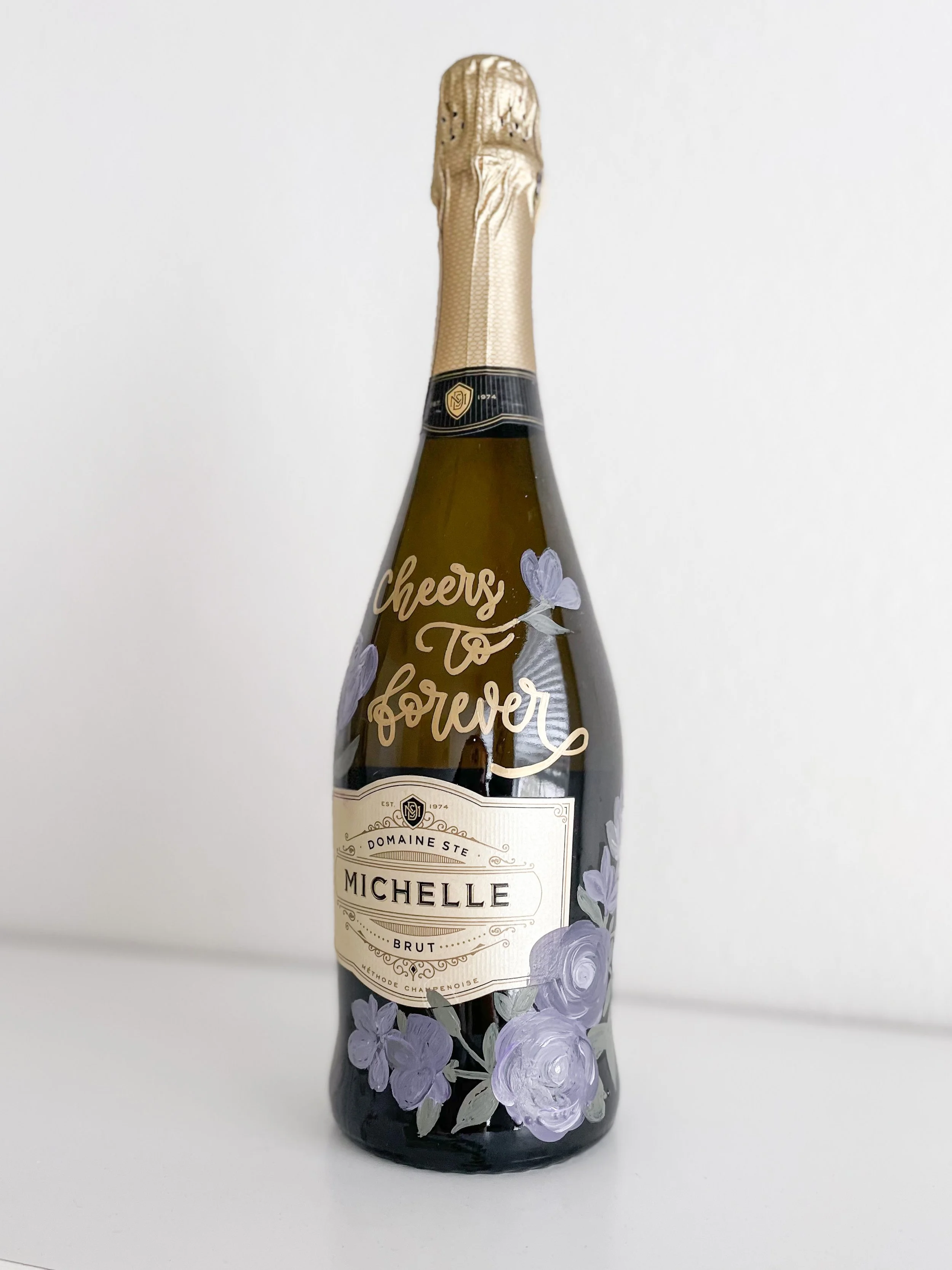 hand painted bottle by a handful of letters