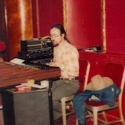 1983 Great American Music Hall. Lee Brenkman mixing on a Yamaha 1516 console with Tapco graphic EQ and Master Room spring reverb. The “console stand” is a pair of then empty cabinets from GAMH’s first “real” monitor speakers, Altec 1221s.