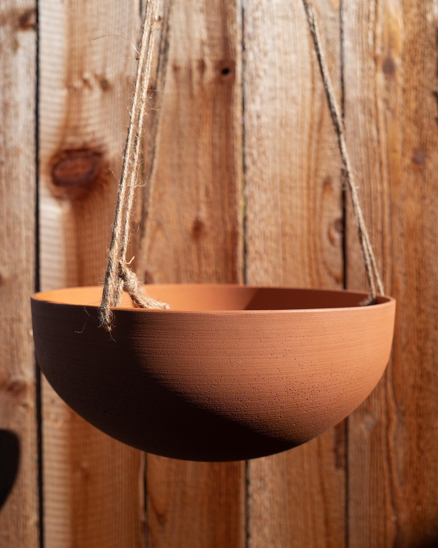 terracotta and rust aren't just hot colors for linen sheets. join us at @follyhome tomorrow. can't wait for your thoughts on our newest batch of hanging planters.