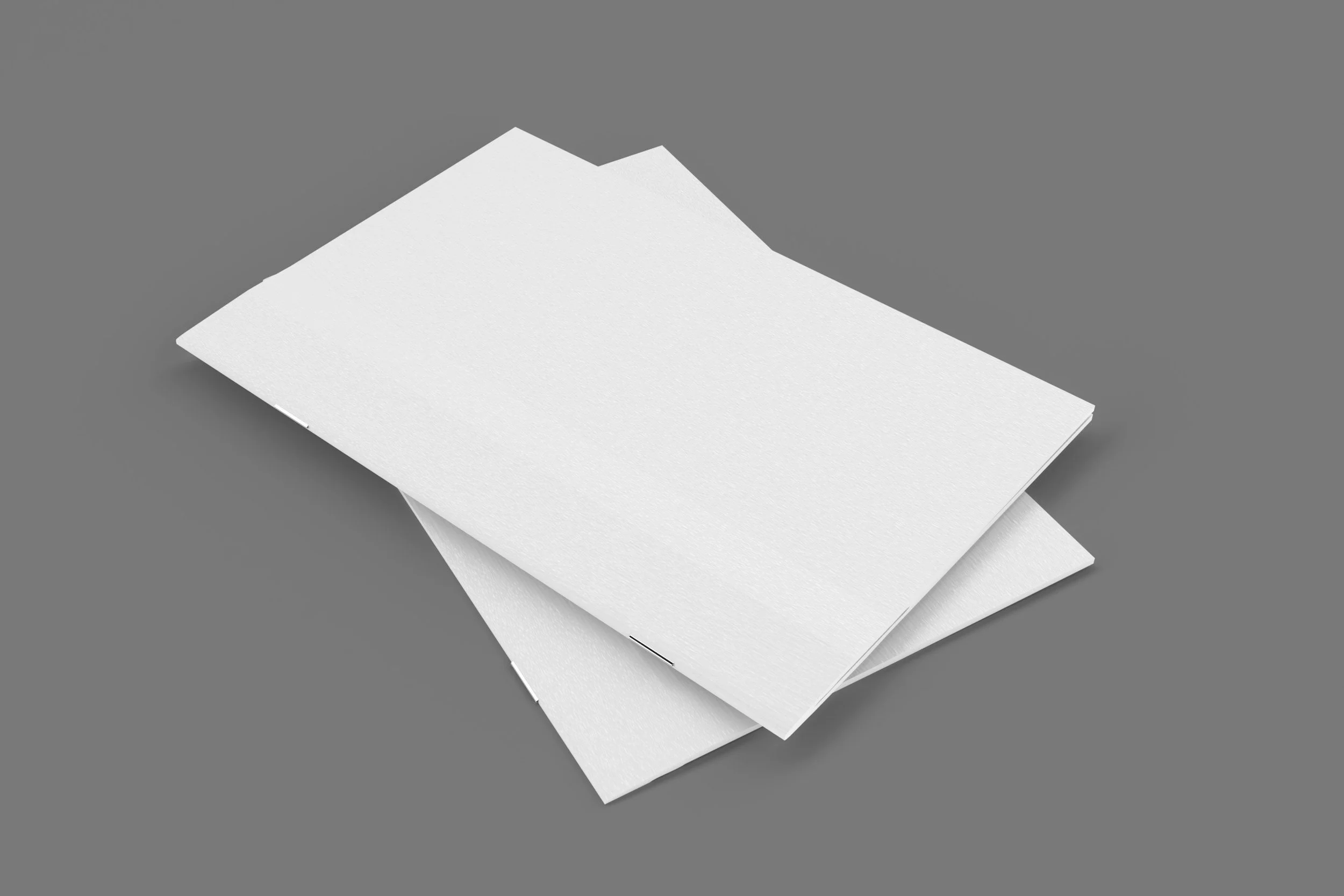 Stack of four blank white sheets of paper on a gray background.
