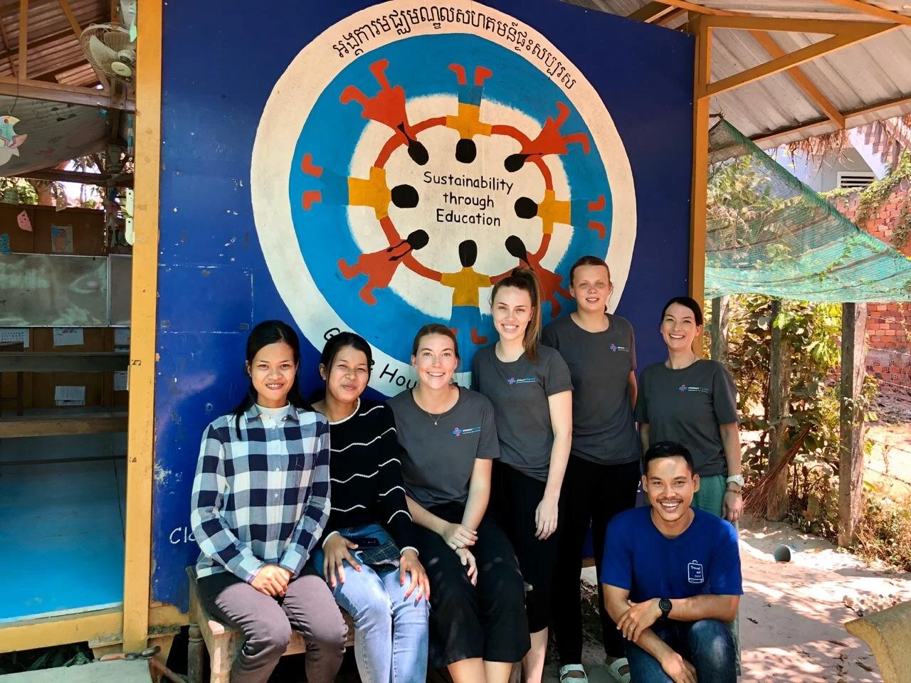 student group and local staff at grace house in cambodia.jpeg