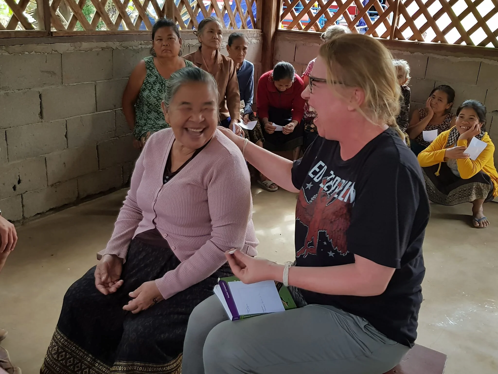 clinical supervisor laughing with local laos woman on placement.jpg
