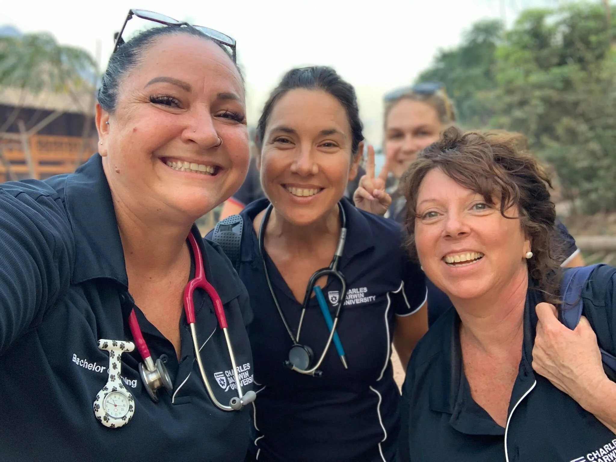 nursing students and clinical supervisor on community health placement in laos.jpg