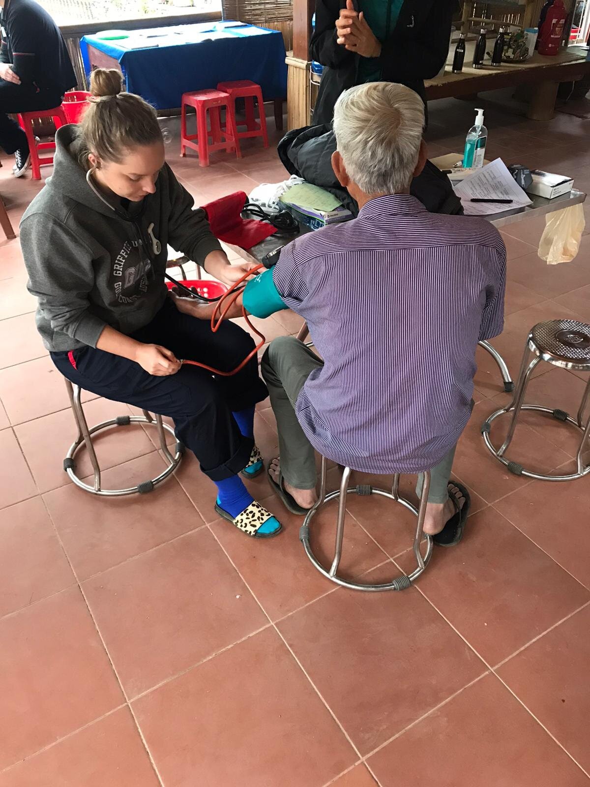 student conducts health assessment in vietnam.jpg