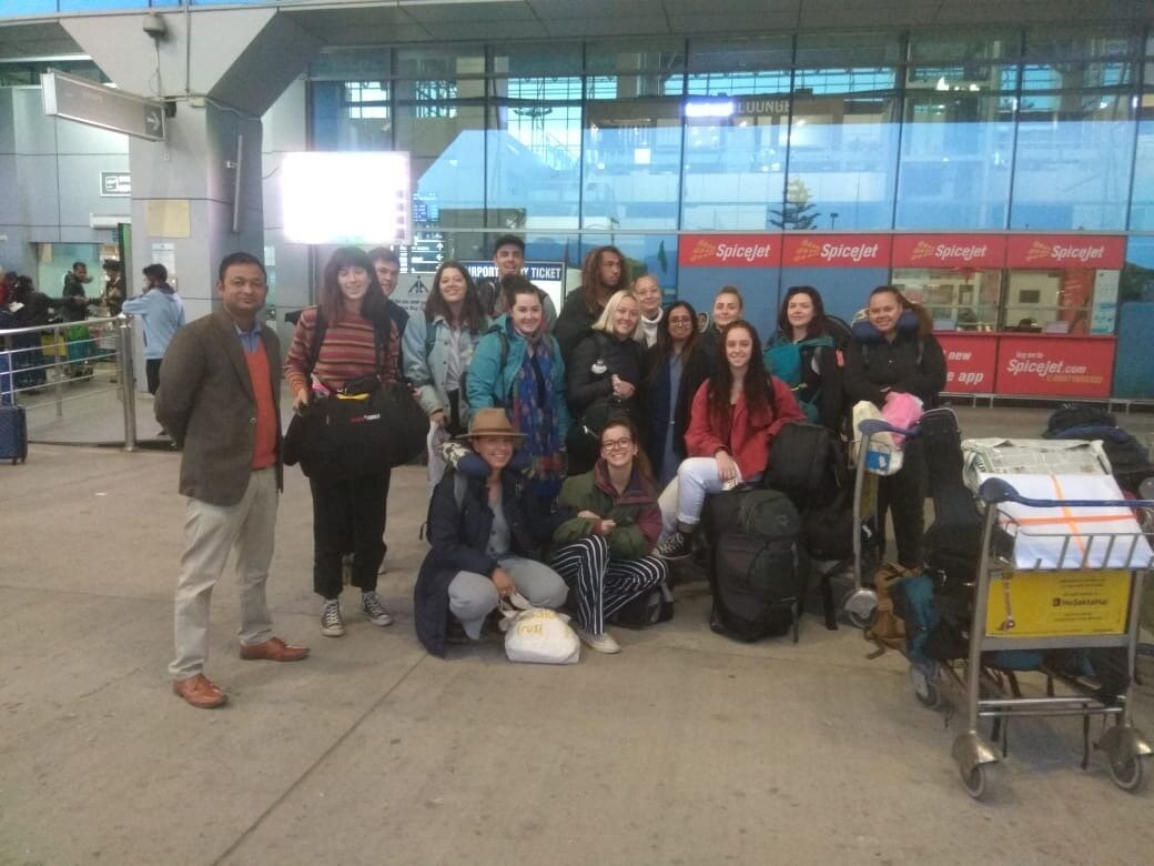 student group at airport while on community internship.jpeg