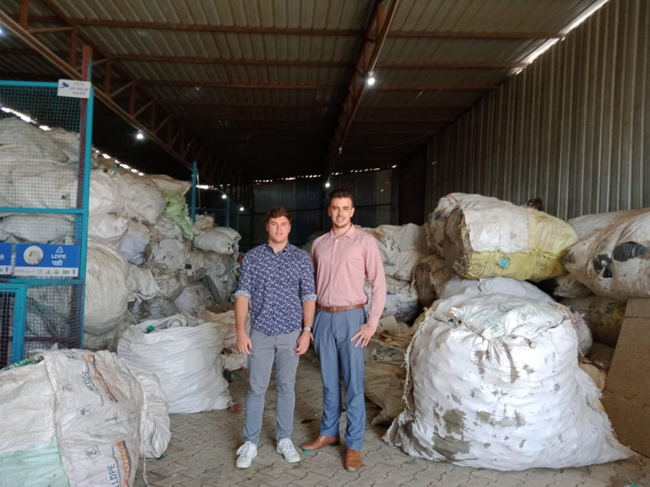 students tour waste management facility in india while on community internship.png