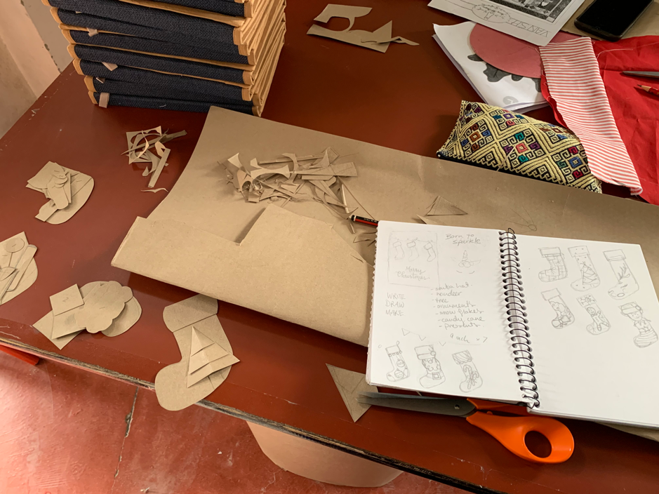 students prepare craft activities for children while on community internship.png