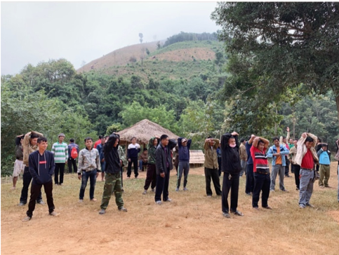 nursing students conduct manual handling and stretching with men from village in laos.png