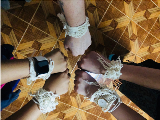 students receive blessing bracelets from villagers in laos.png