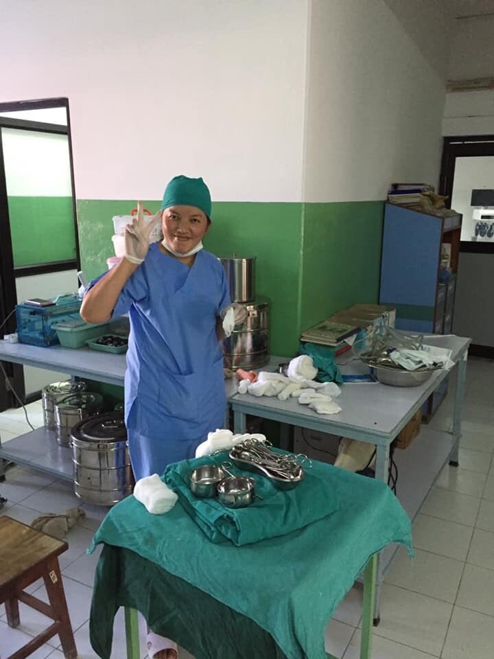 nursing student helps prepare for surgery in nepal.jpeg