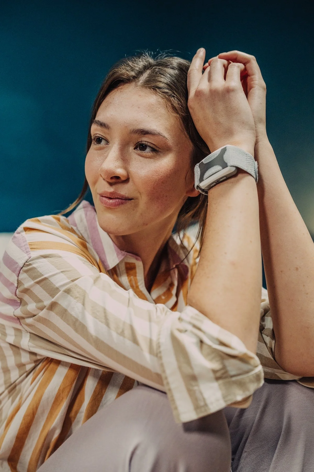 A woman wearing an Apollo Neuro