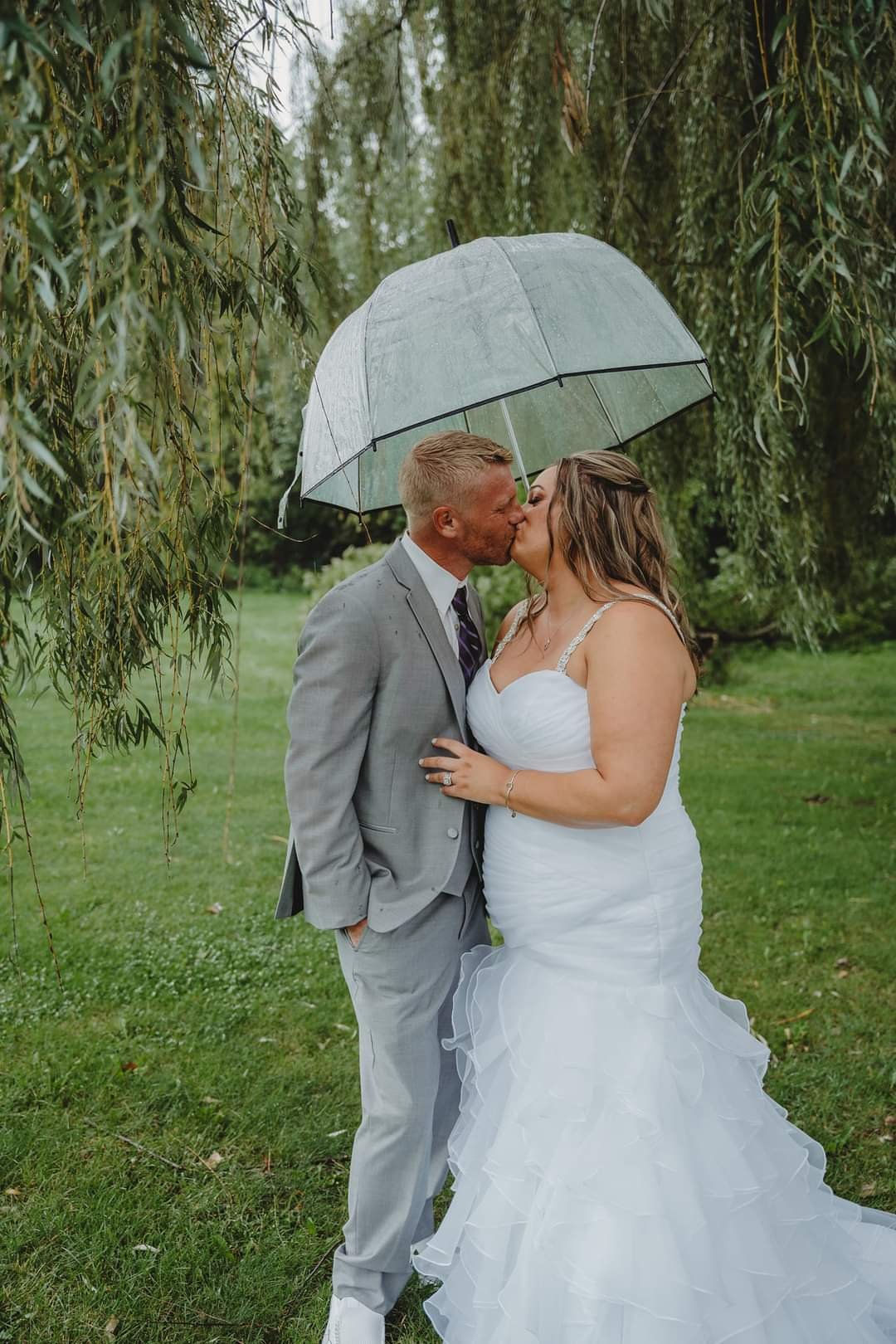Wedding Photo - kissing under umbrella.jpg