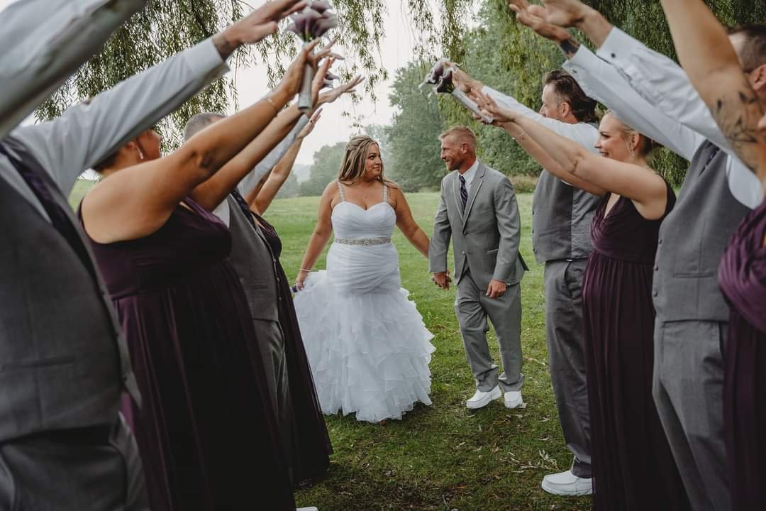 Wedding Photo - Going under arms of wedding party.jpg