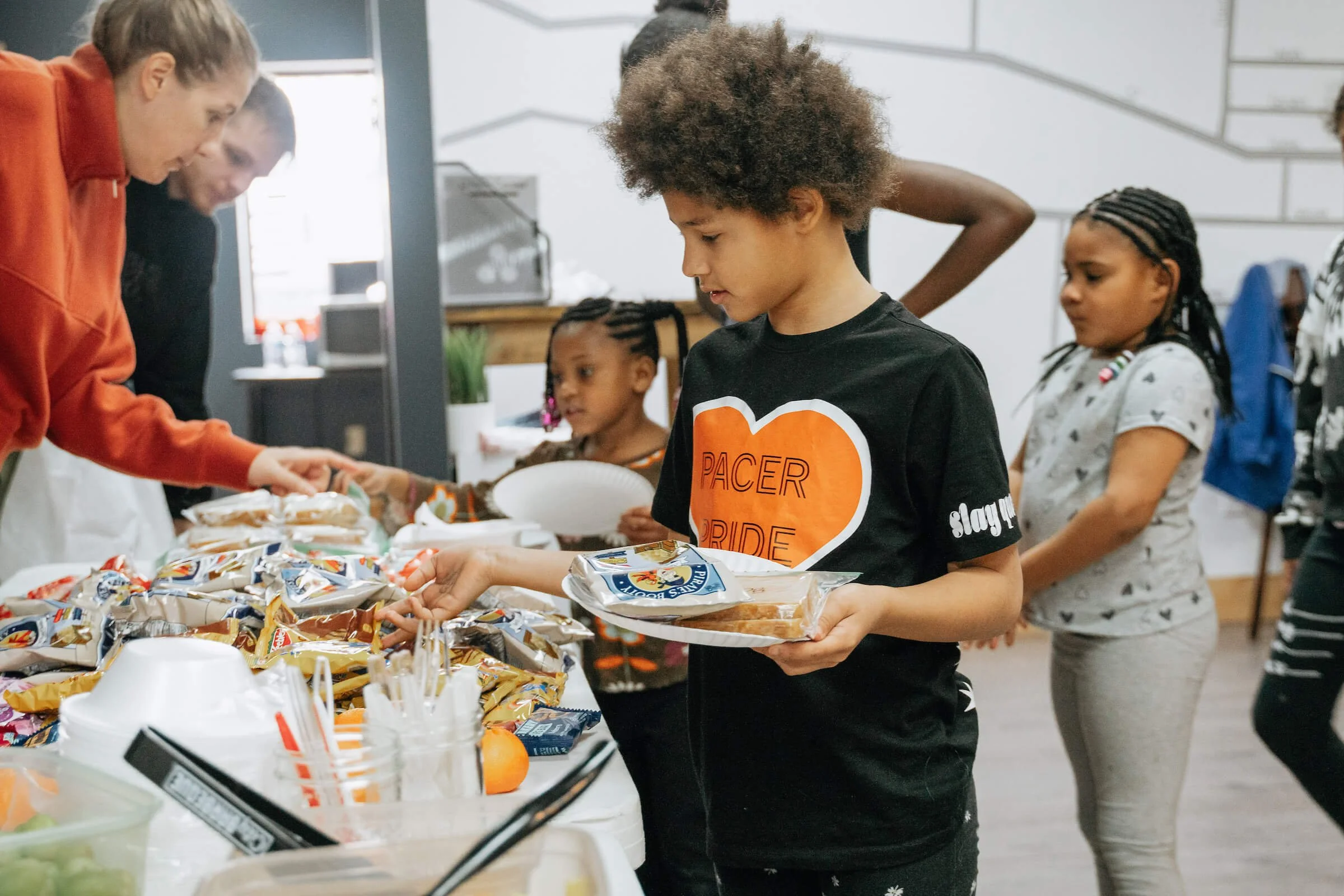 Kids Getting Lunch at Dream Center Super Saturday