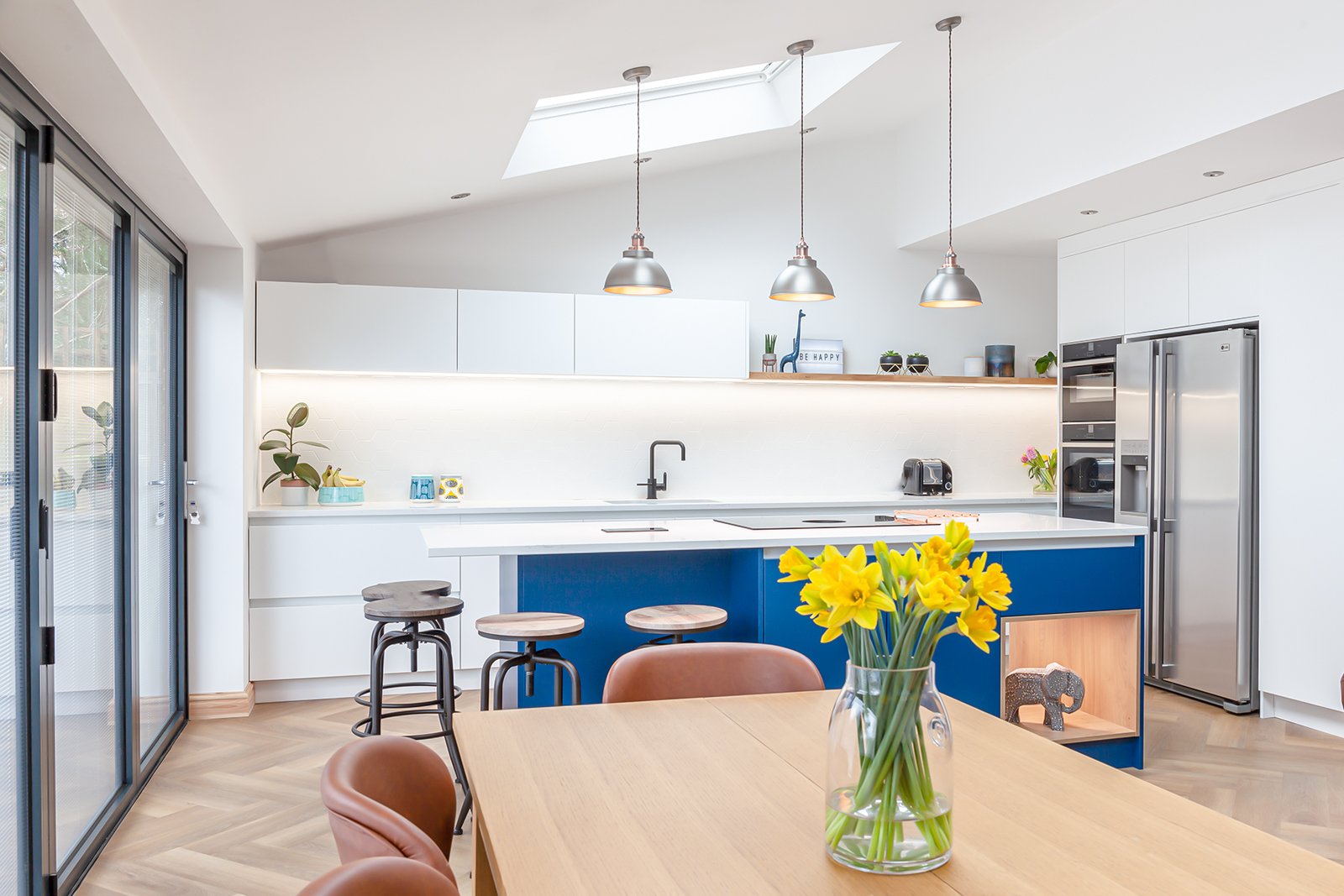 Kitchen dining with blue cabinets