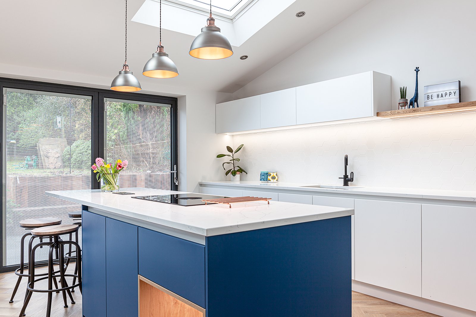 Blue kitchen island with display cabinet