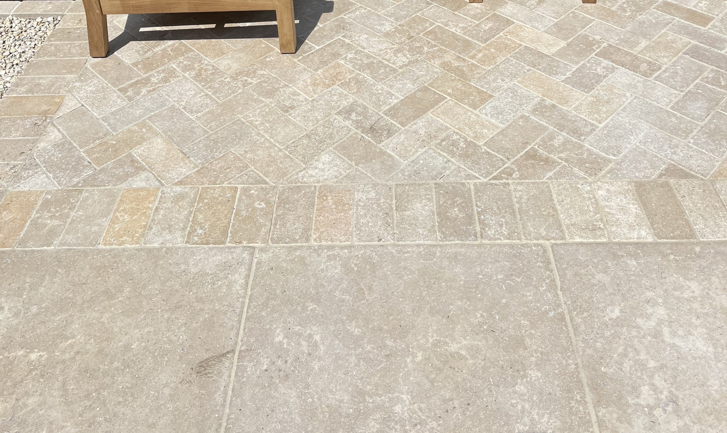Paving detail - limestone paving and cobbles in herringbone