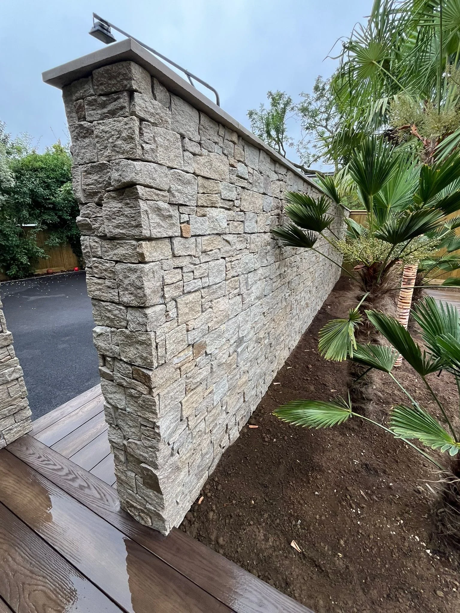 Stone clad wall