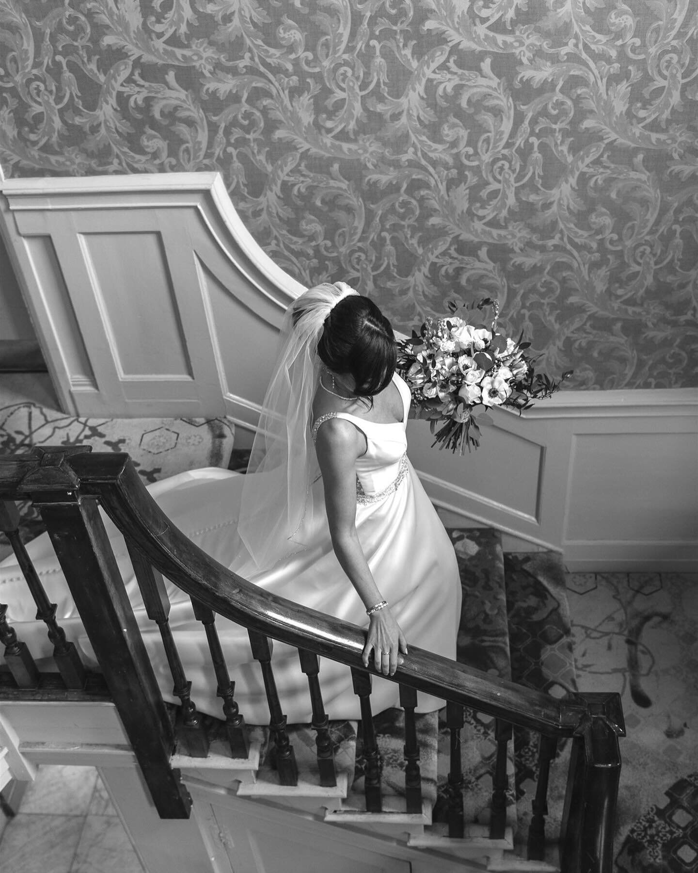 I love the quiet moments with the bride just before she heads down to marry her love. 
It&rsquo;s a few precious moments where I search for all the little details; the buttoning of the dress, fastening of the shoe, movement of fabric and shimmering j
